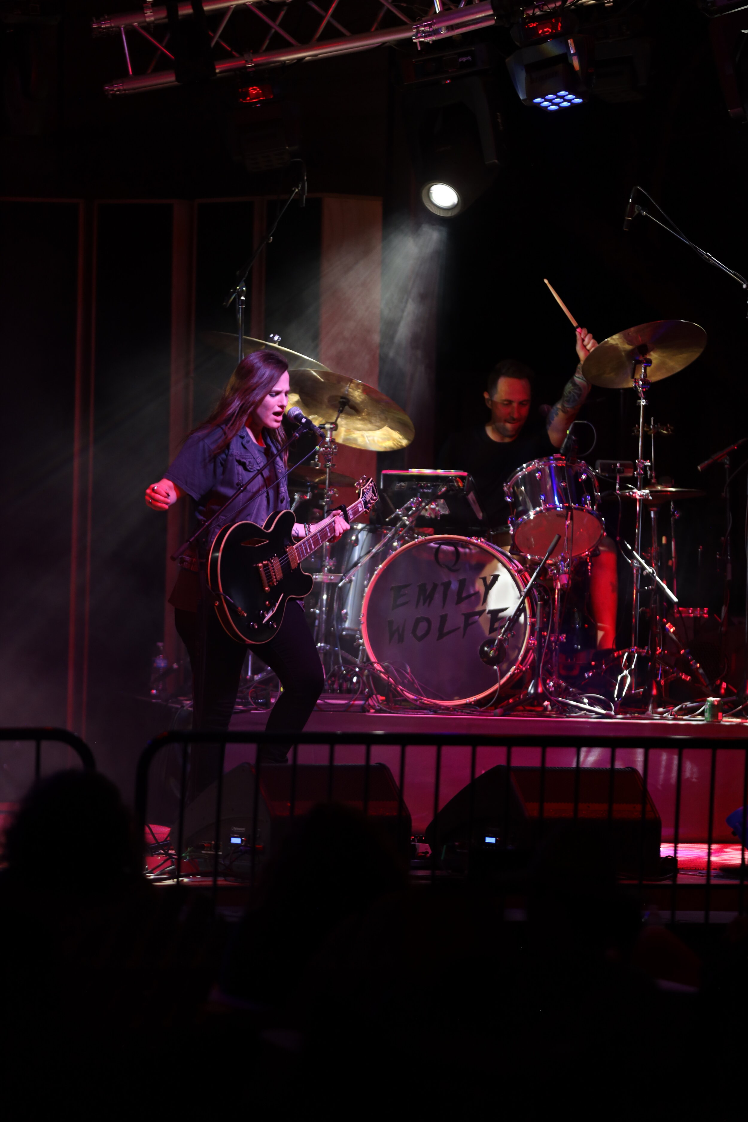  The band members playing as the audience watches from their tables and seats outside.&nbsp;   