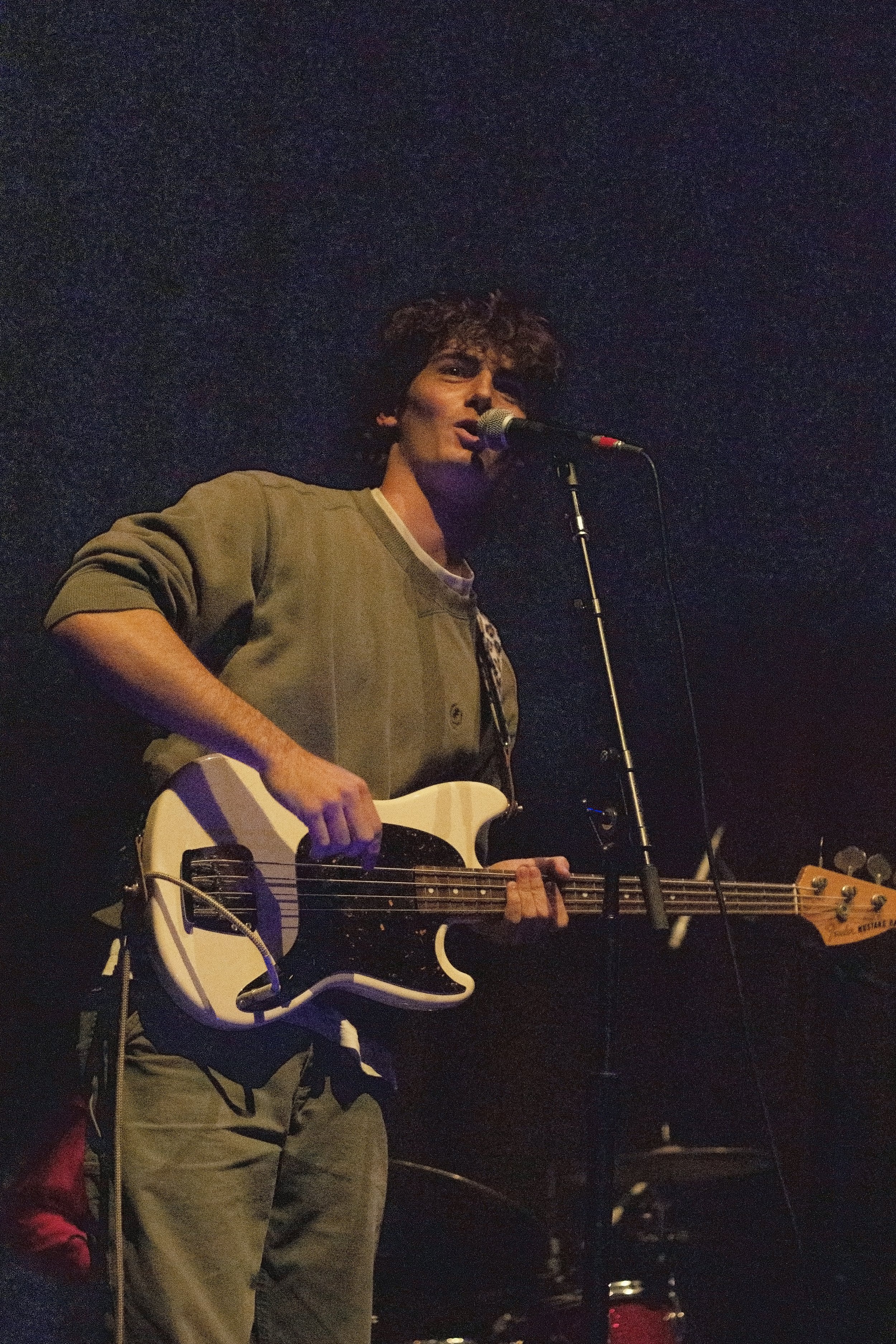  Sun Room bassist Max Pinamonti looks up at a fan in the crowd as he plays 