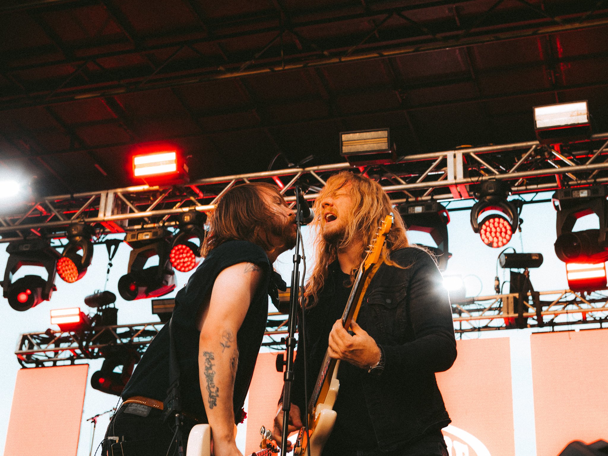  Guitarist Jared Monaco and bassist Garret Nickelsen jam out together on stage. 