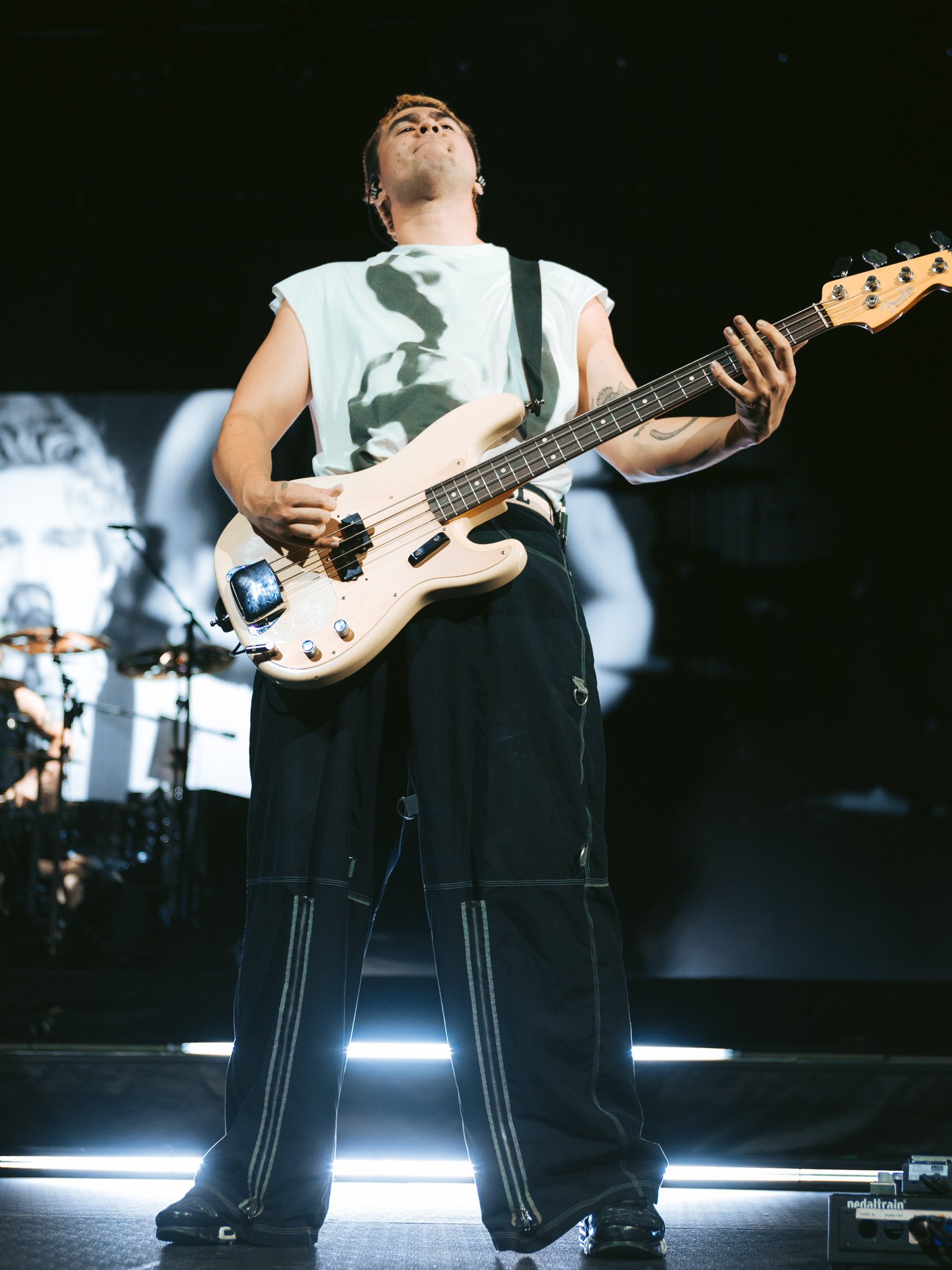  Bassist Calum Hood rocks out to the band’s opening song, “No Shame.” 