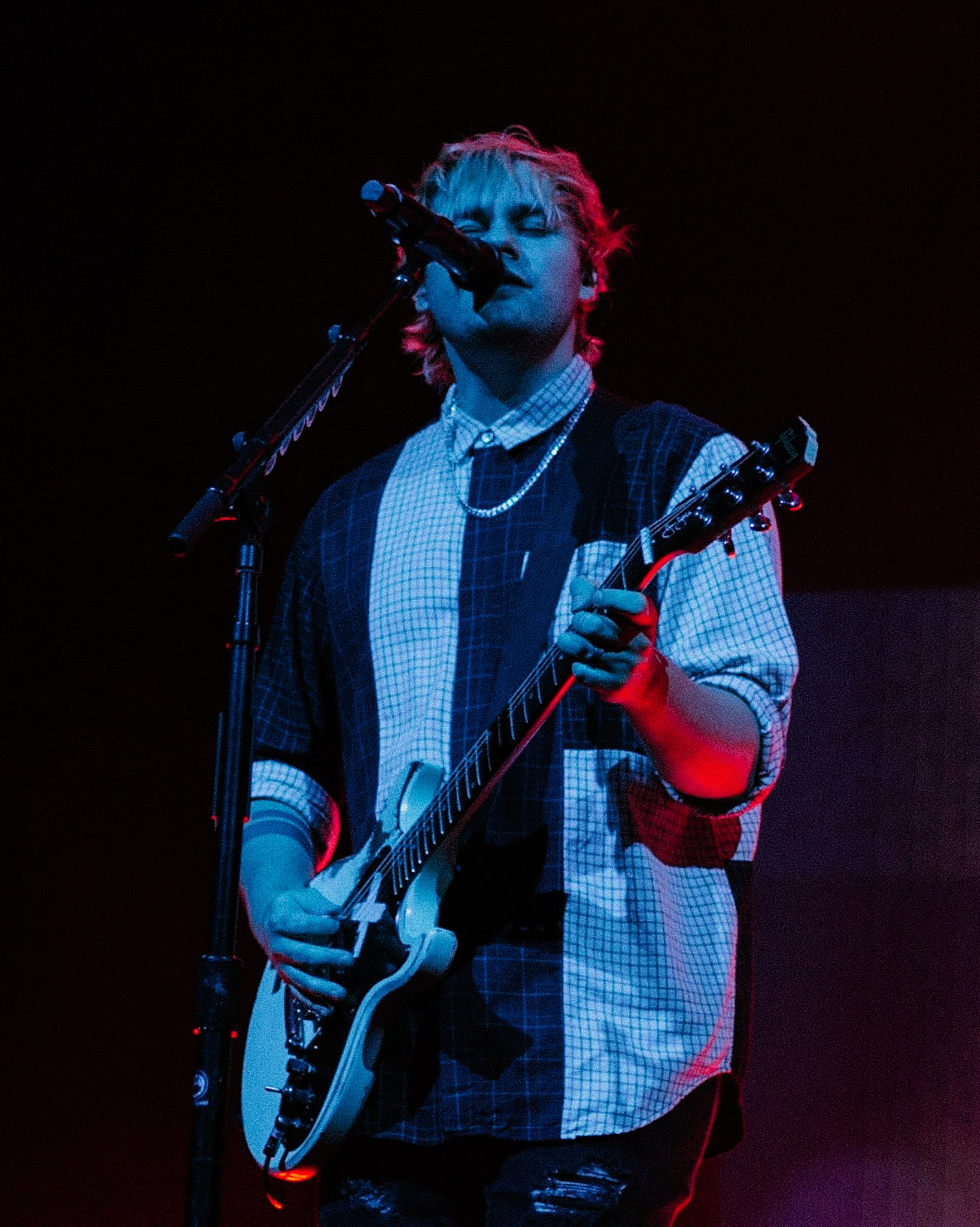 Guitarist Michael Clifford feels the music as the band performs “More .”  