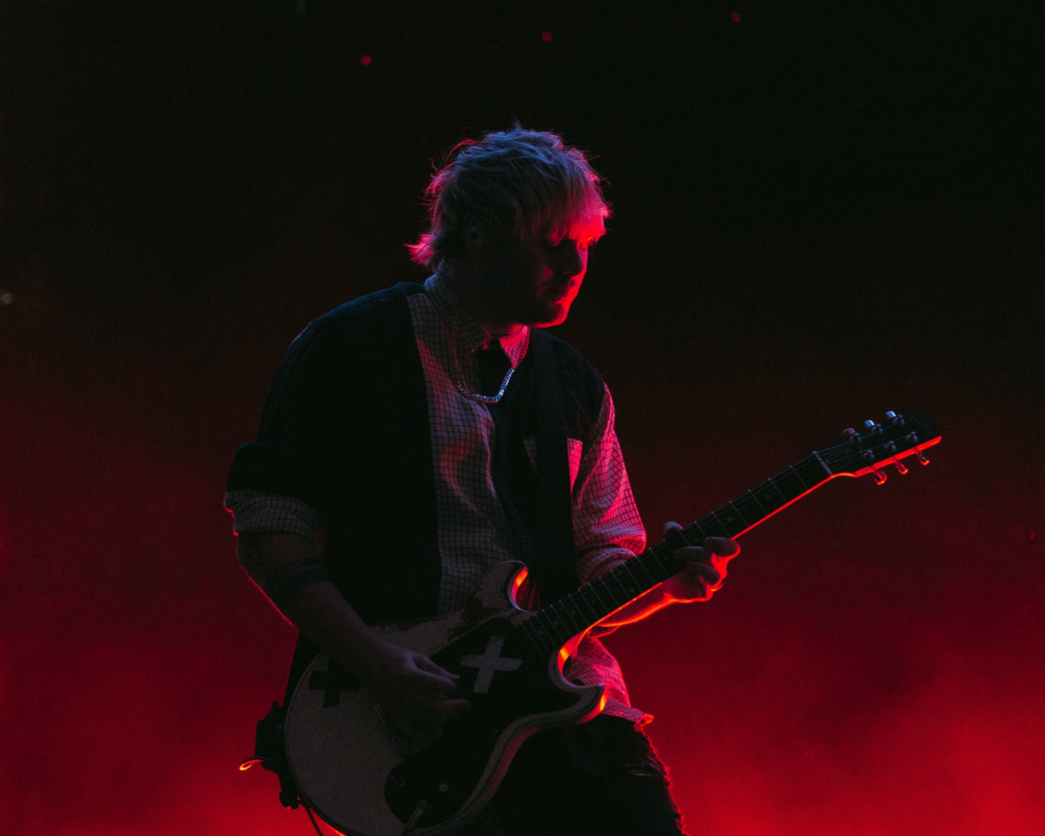  Guitarist Michael Clifford feels the music as the band performs “More .”  