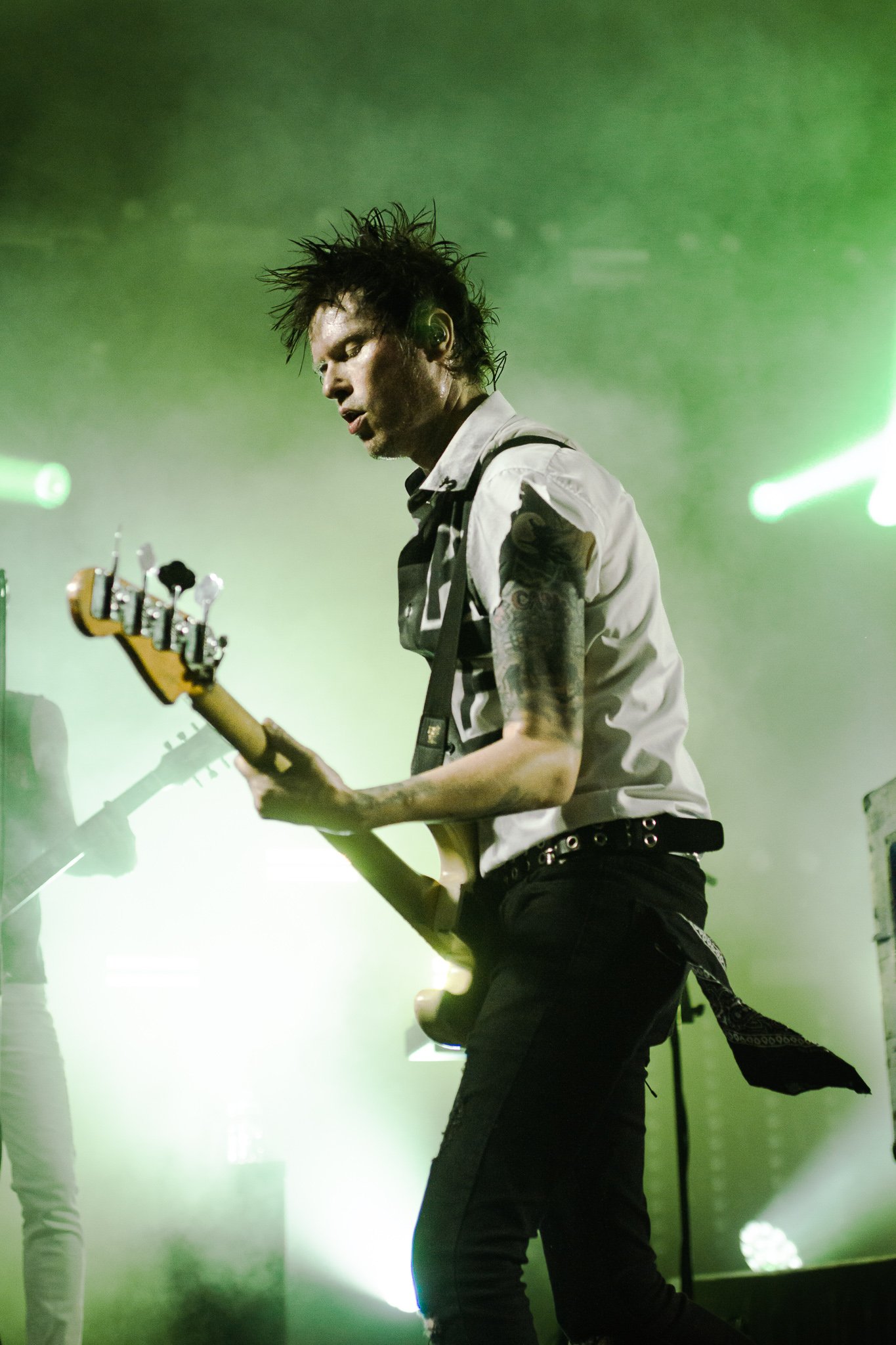  Bassist Jason McCaslin of Sum 41 plays his heart out to the excited crowd. 