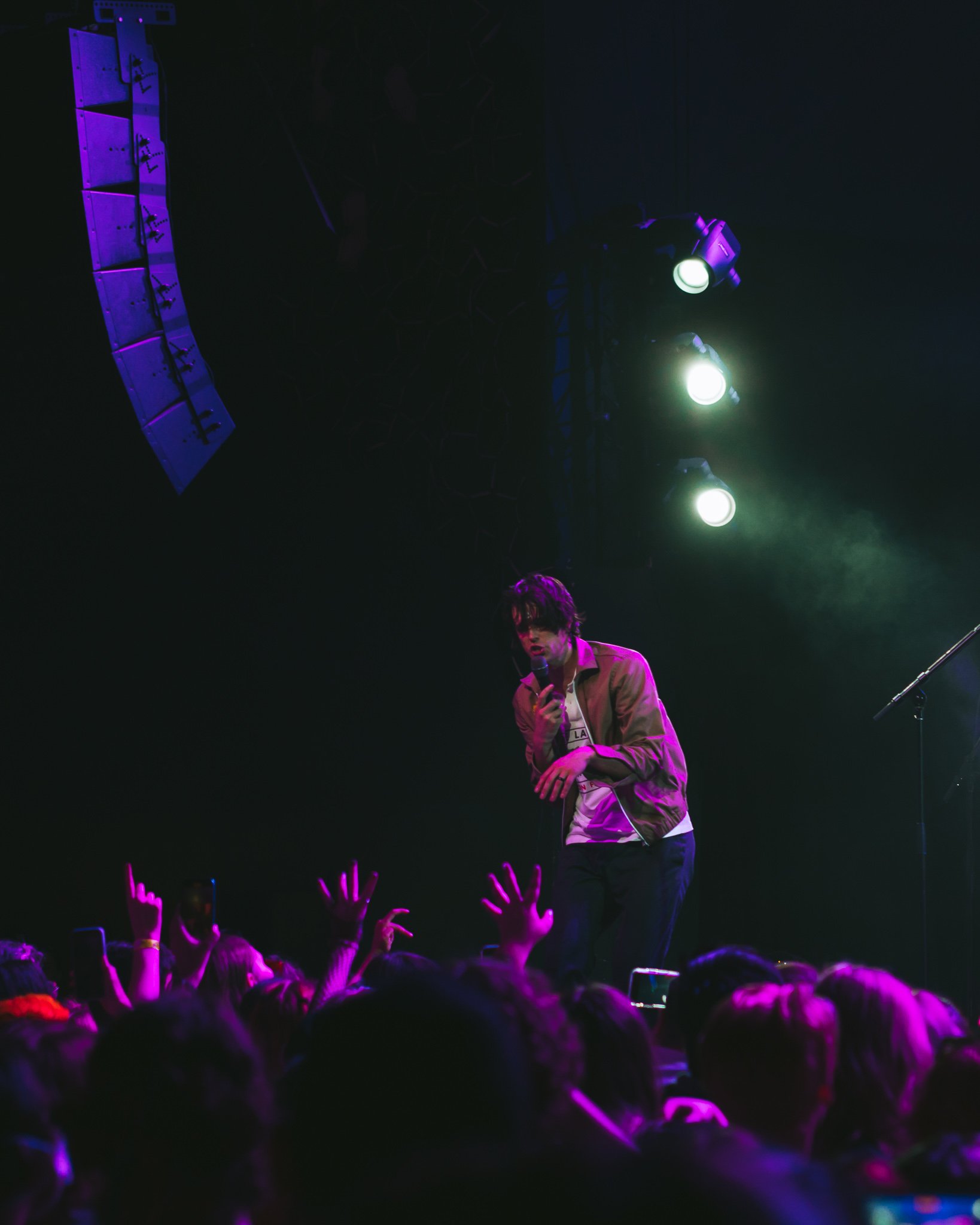  Dallon Weekes draws in the crowd with his captivating performance. 