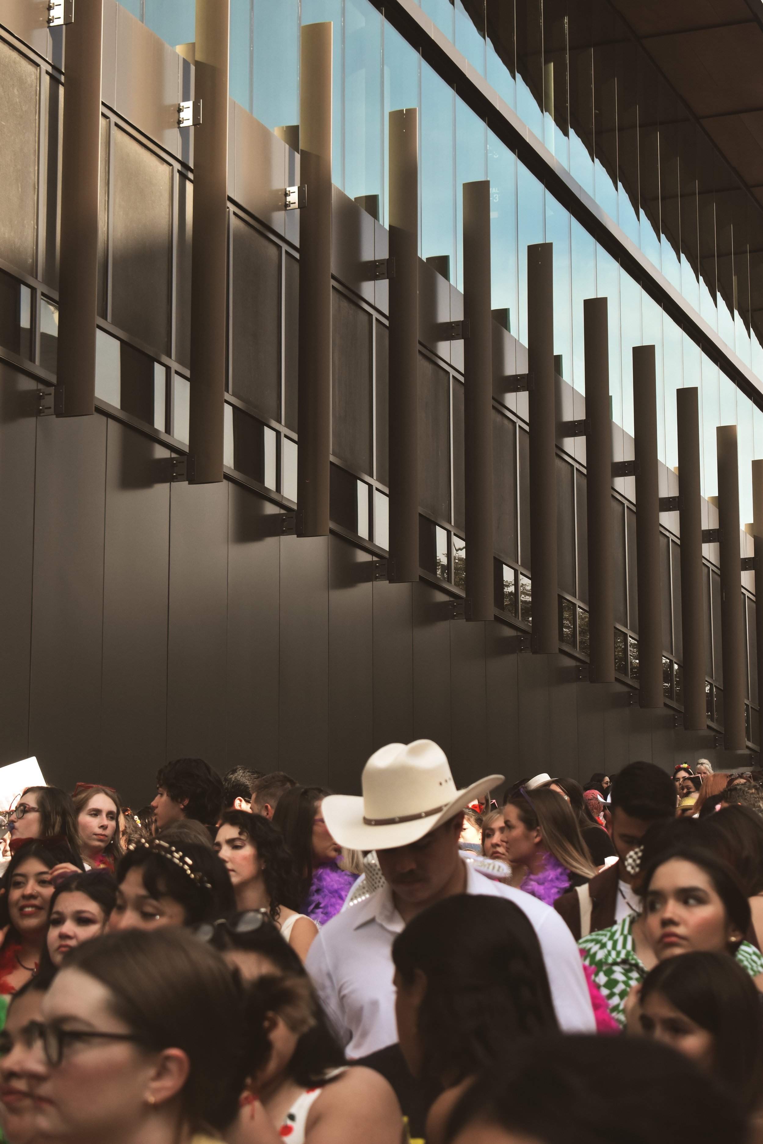  A lone cowboy waits in the General Admission Pit line. 