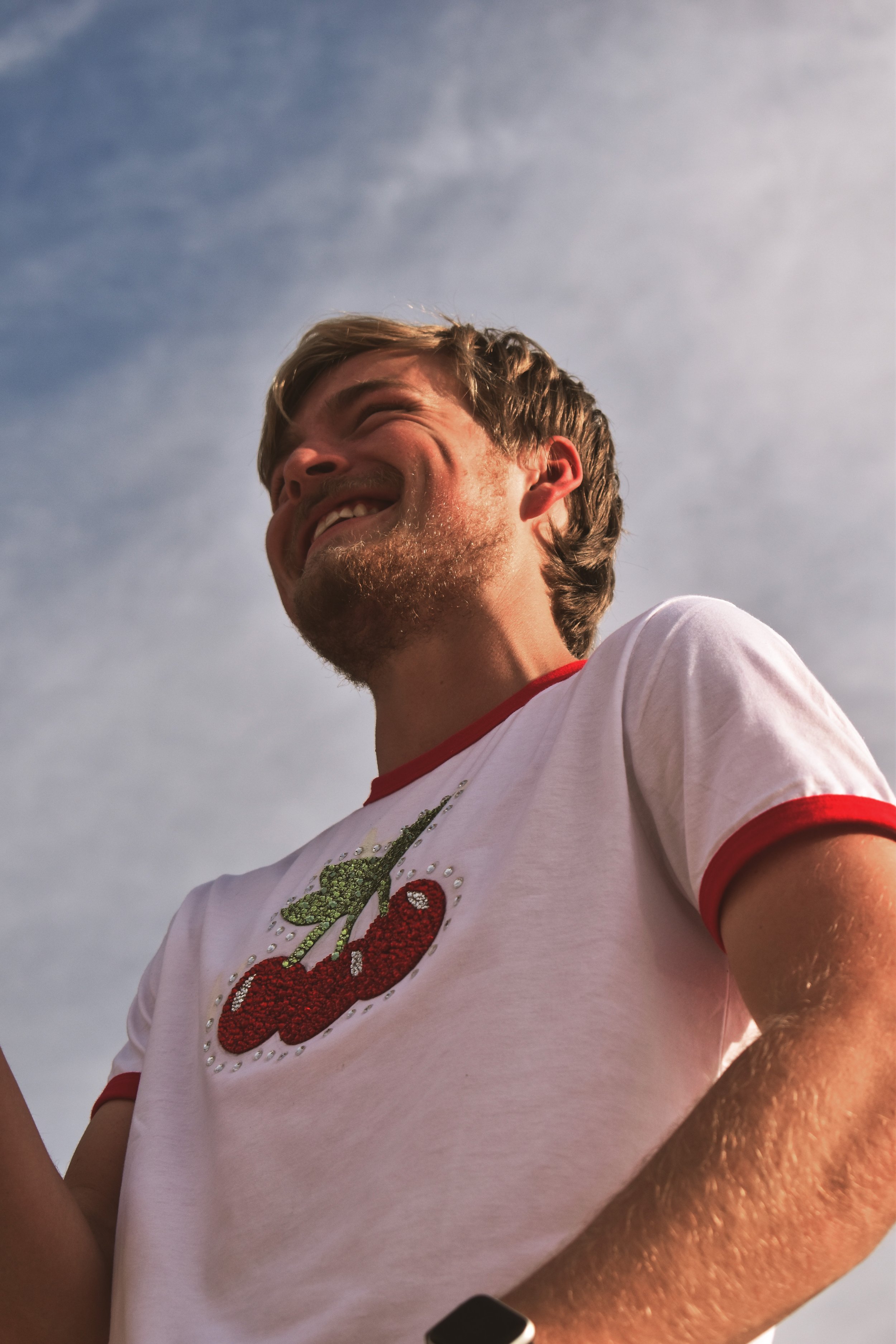  UT senior Kevin embraces the Styles style in a bedazzled cherry shirt. “[Love on Tour] is the place to wear stuff like this … it’s also a chance to do it and everyone loves it, no one’s gonna make fun of you for it,” he said. 