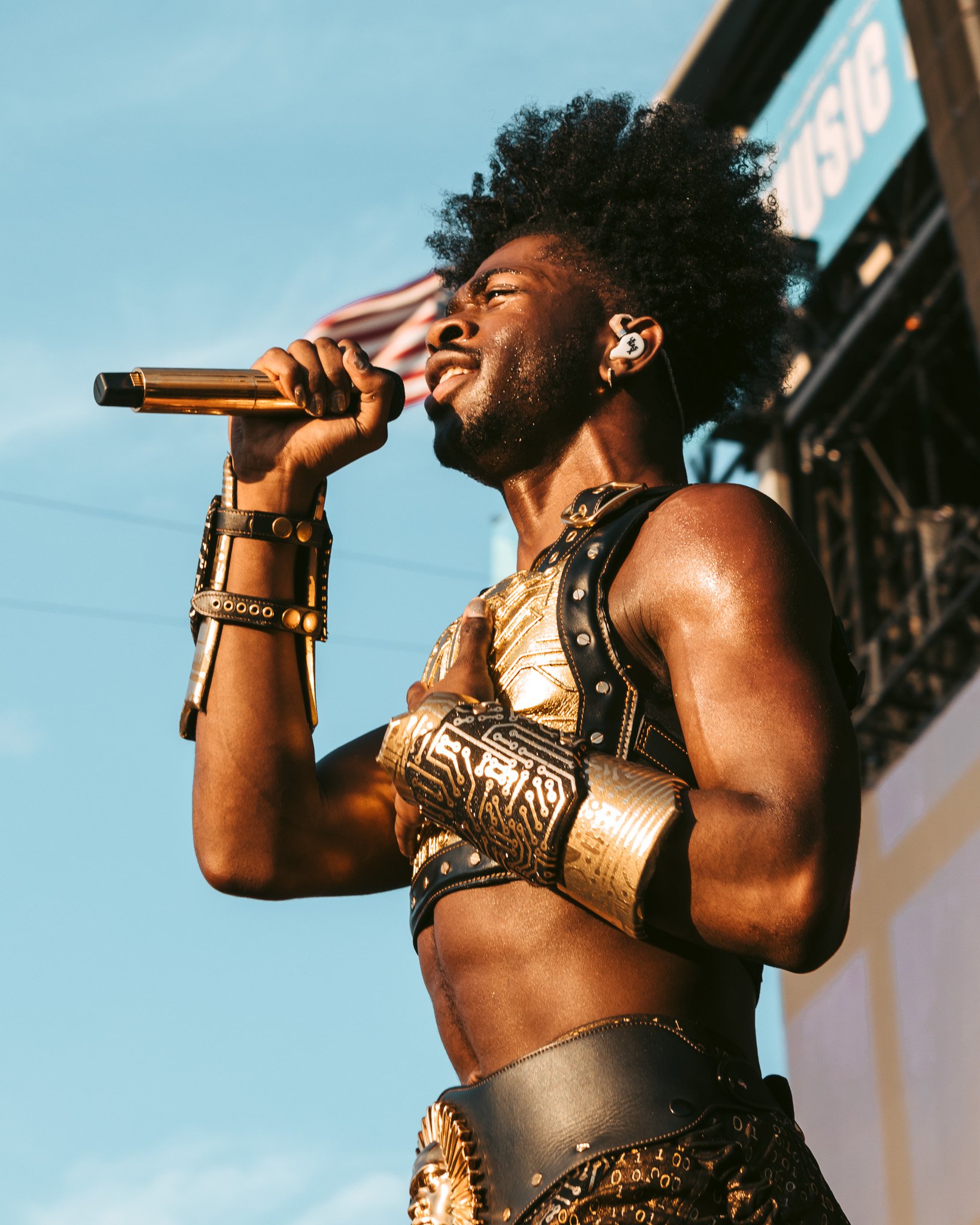  Hip-hop icon Lil Nas X glows in his golden suit on the American Express stage. 