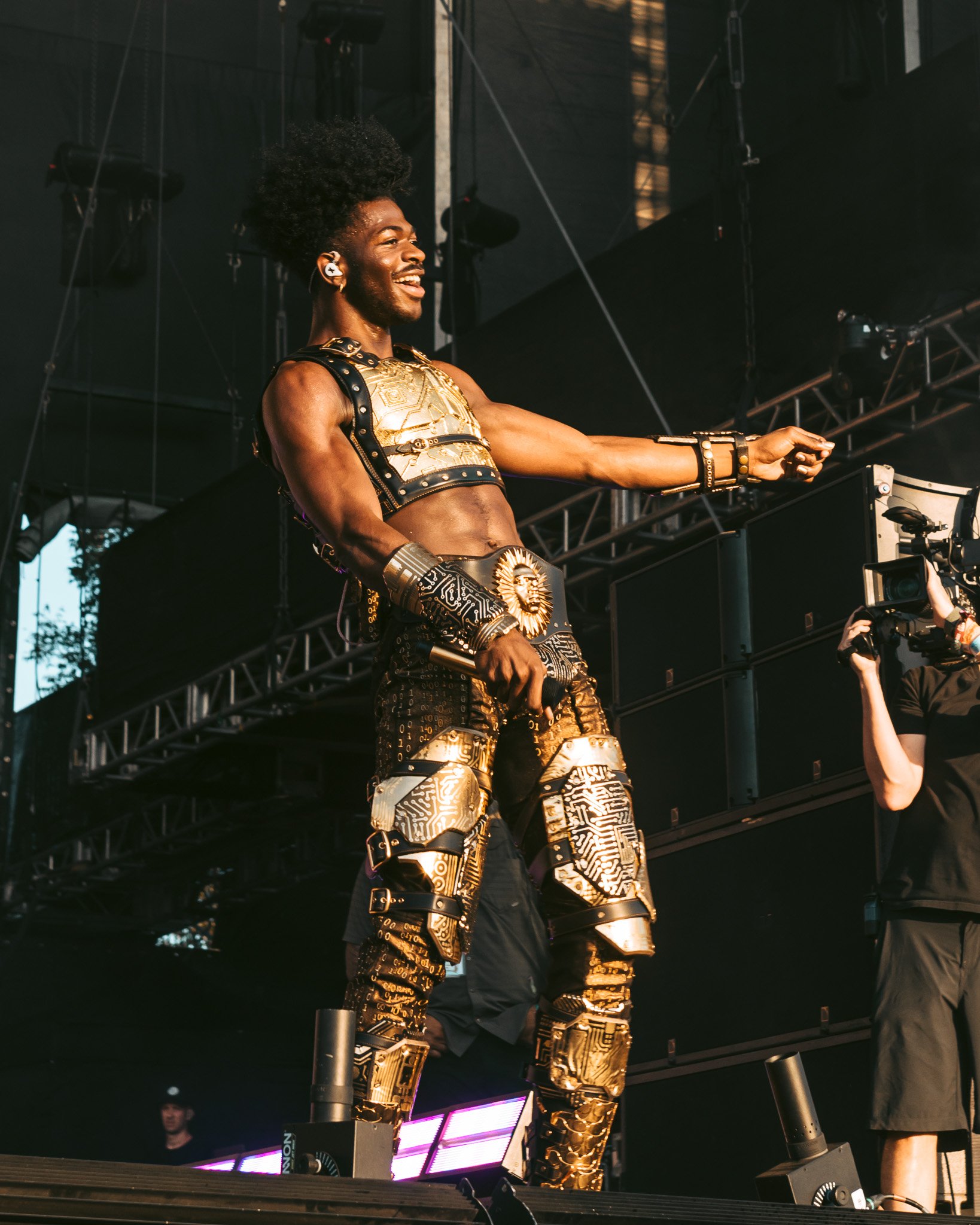  Hip-hop icon Lil Nas X glows in his golden suit on the American Express stage. 