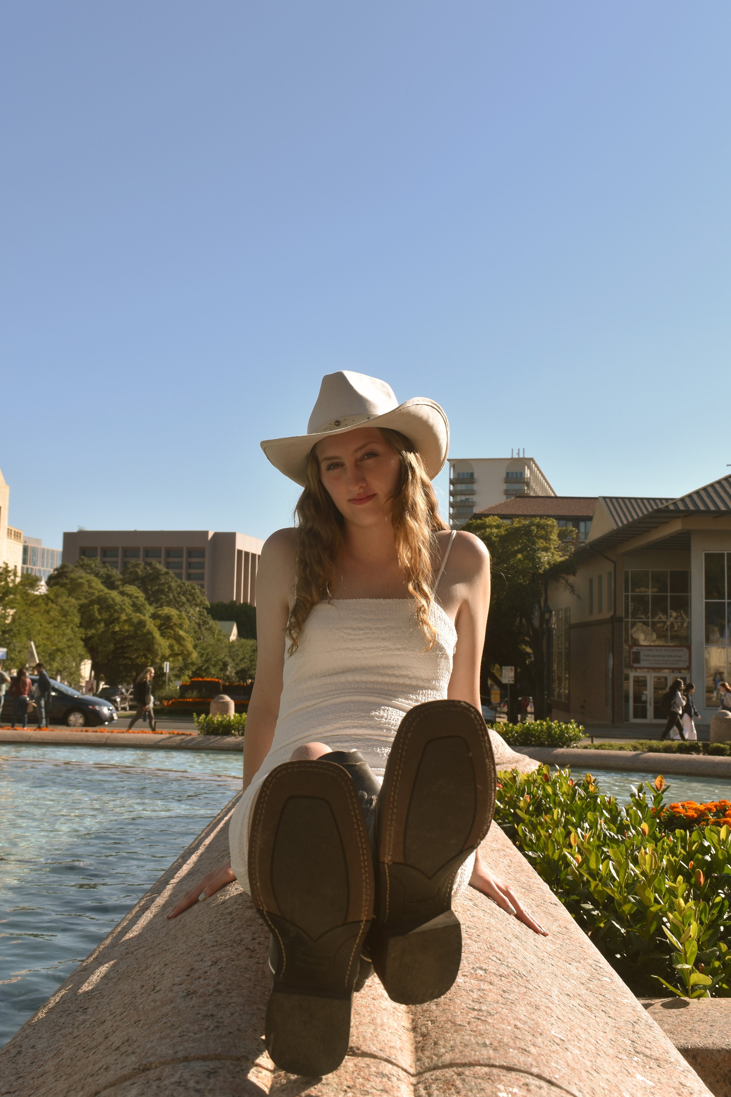  Taylor’s  Debut : Cassie Bullough channels her inner country music star at the campus fountain. 