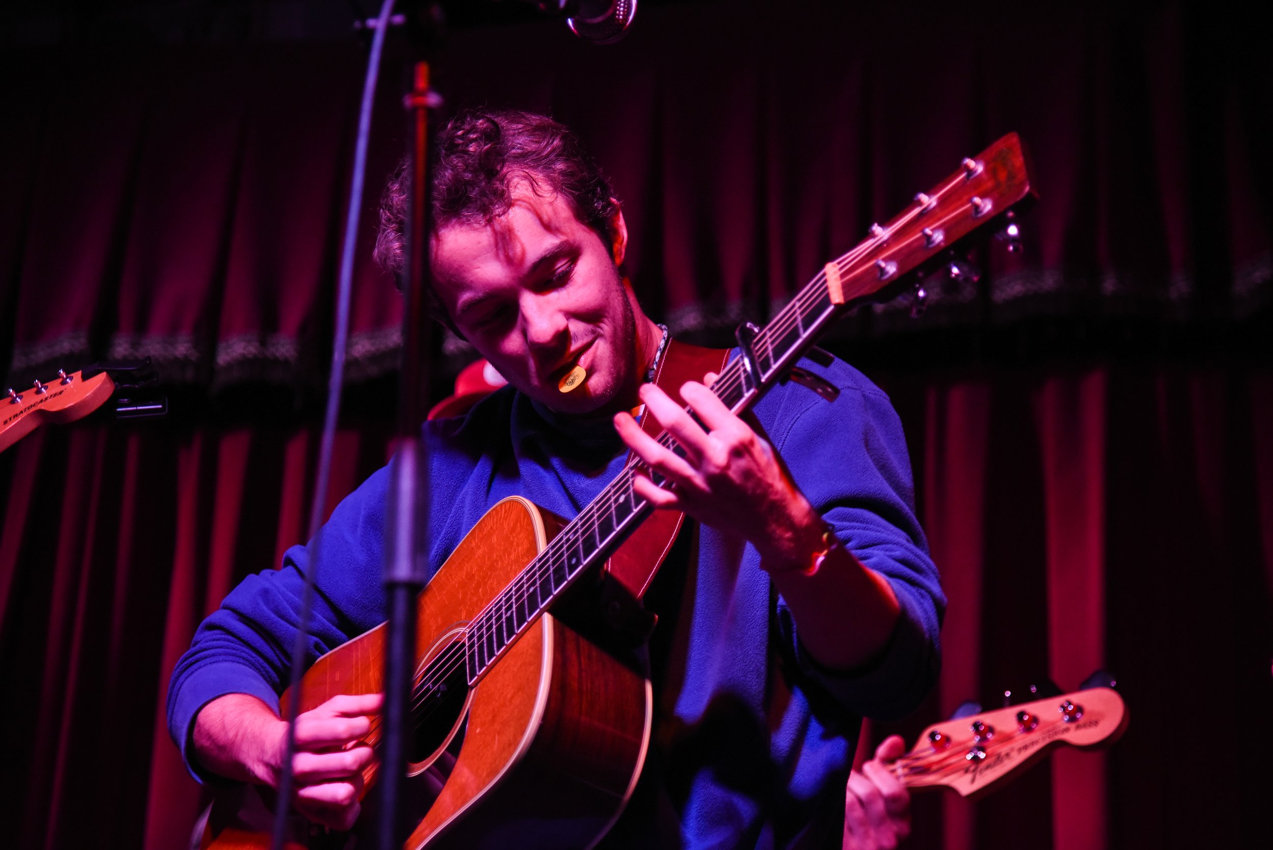  The lead singer of Wednesday Kid, Will Derden plays his guitar with his pick in his mouth.  Photo by Mackenzie Coleman  