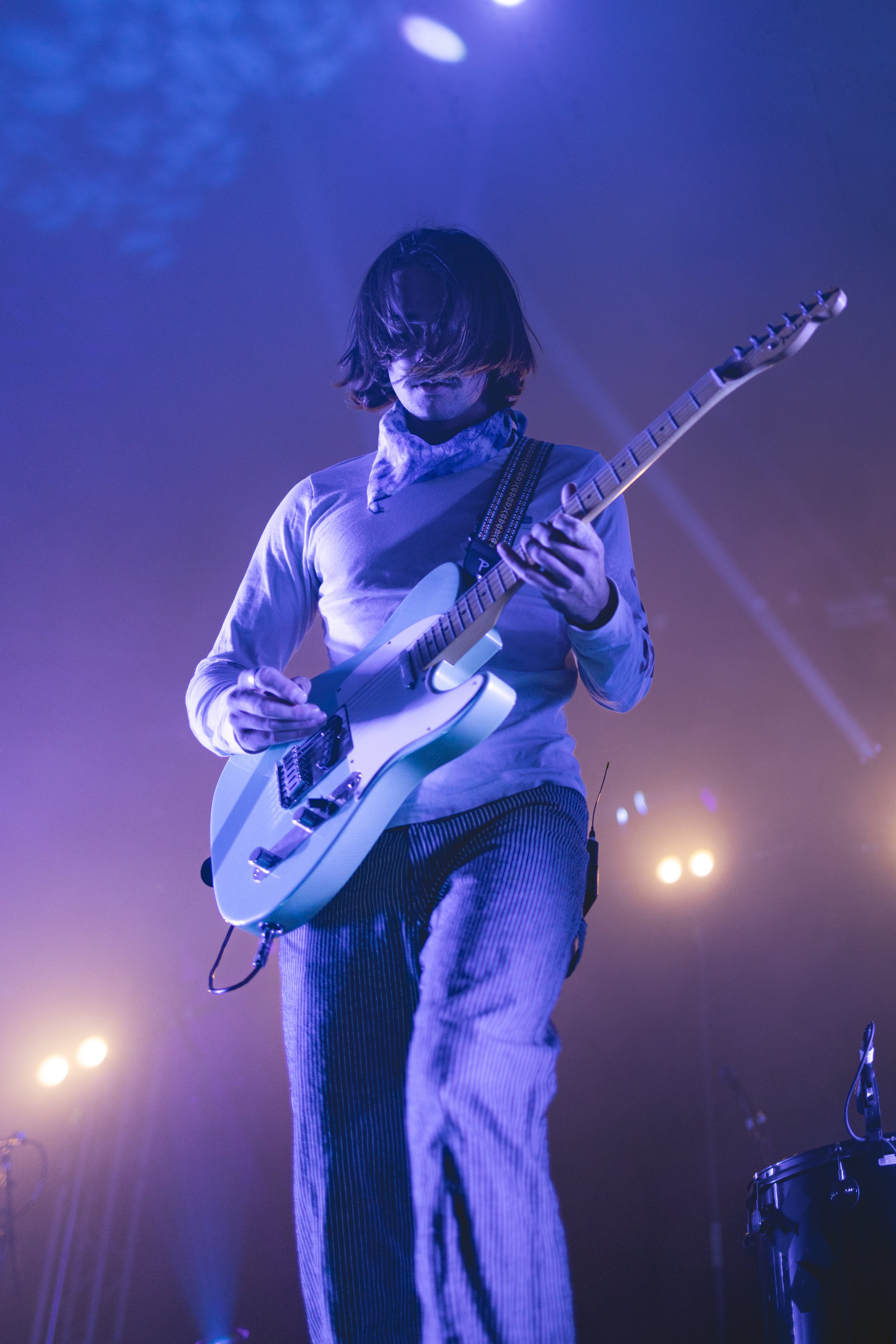  Griffin Washburn, the singer and instrumentalist of Goth Babe, adds dynamic to his vocal performance by strumming on the guitar. 