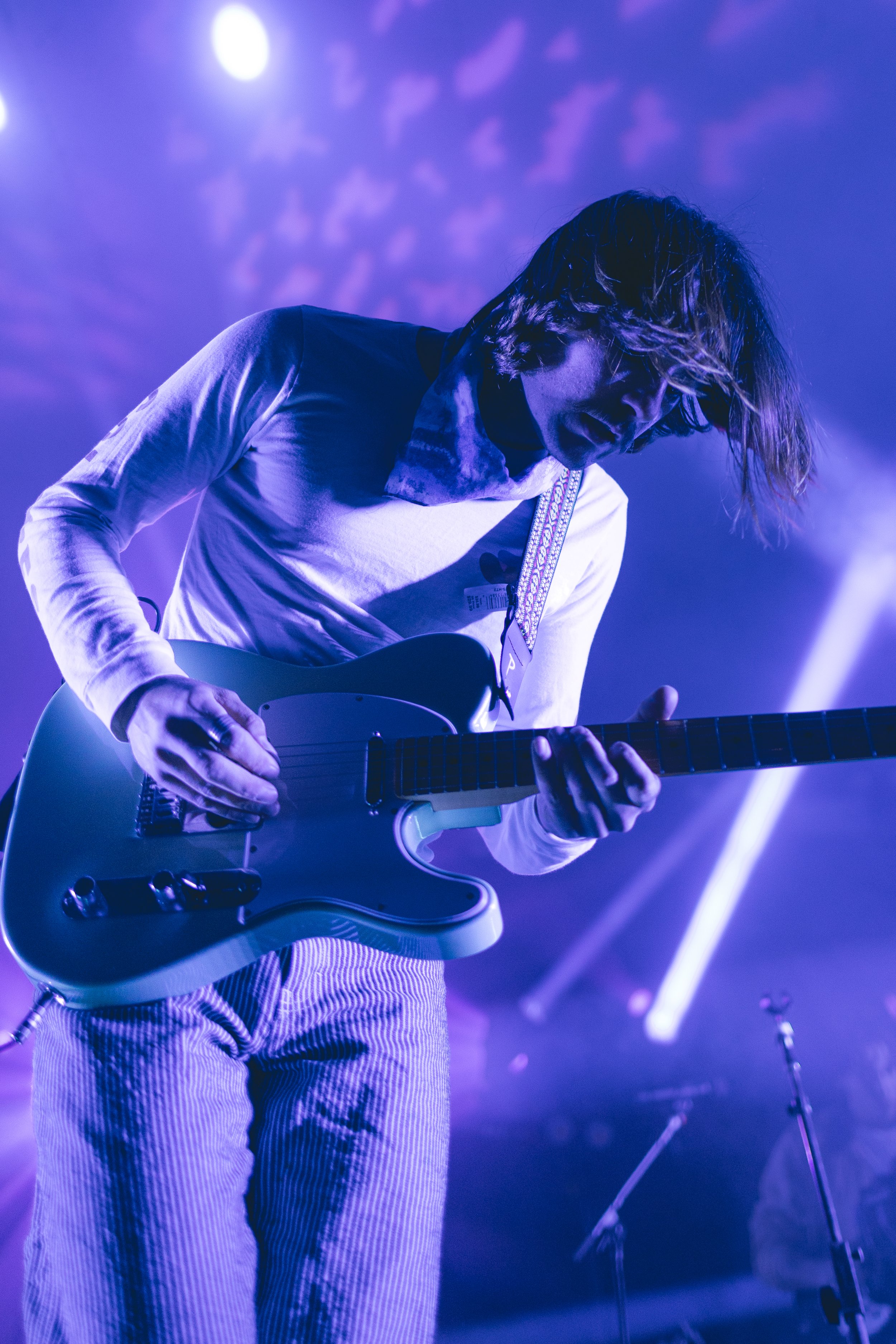  Griffin Washburn, the singer and instrumentalist of Goth Babe, adds dynamic to his vocal performance by strumming on the guitar. 