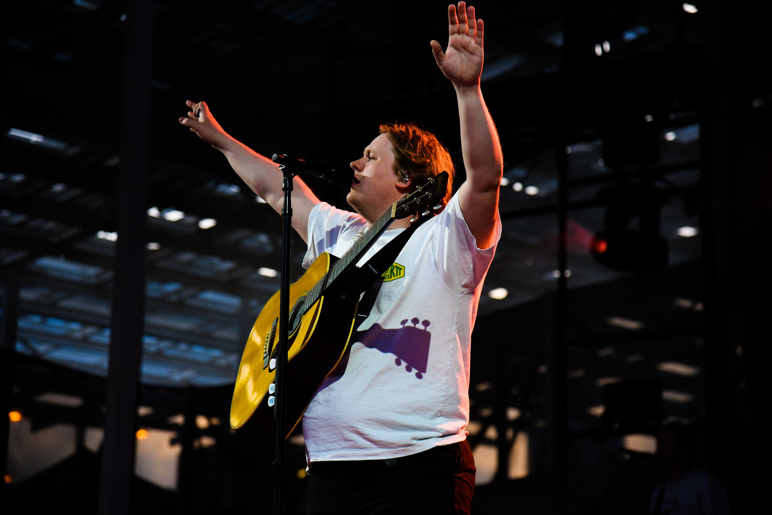  Lewis Capaldi lifts his hands toward the sky as he sings “Forever.” 