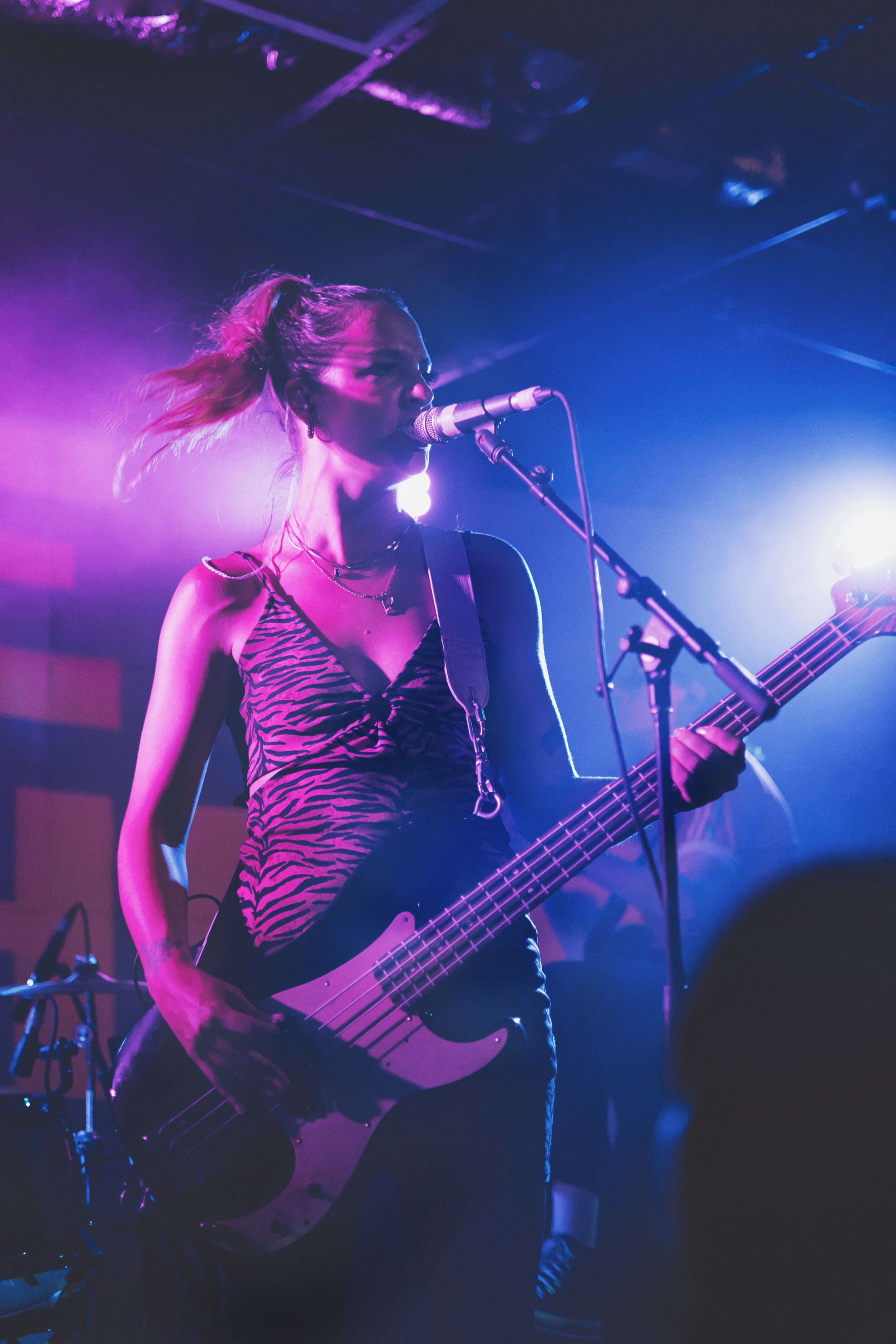  Jordan Miller, bassist and lead vocalist, adds grit to her stage presence while singing. 