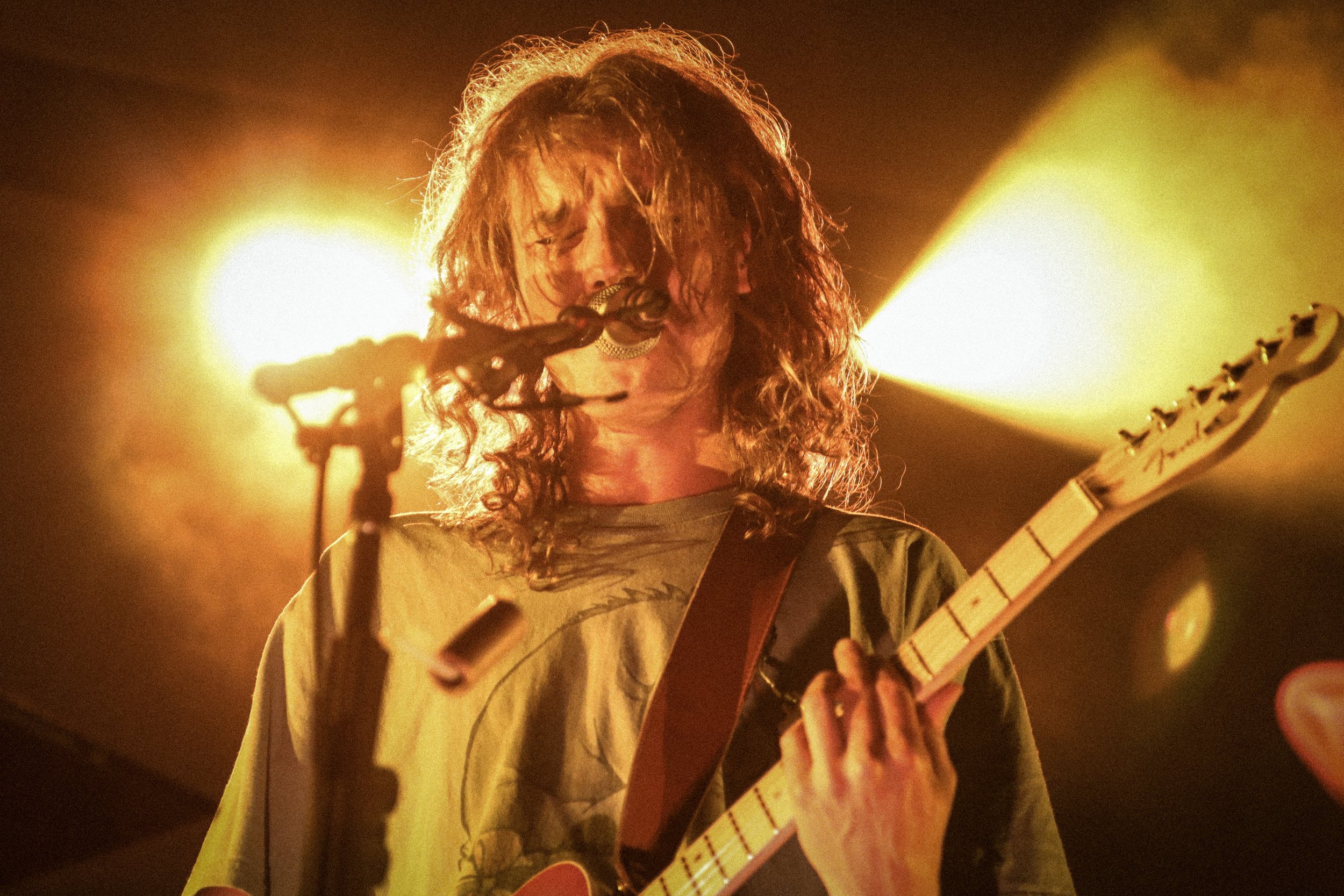  Lead vocalist Joshua Harmon jams out on the guitar. 