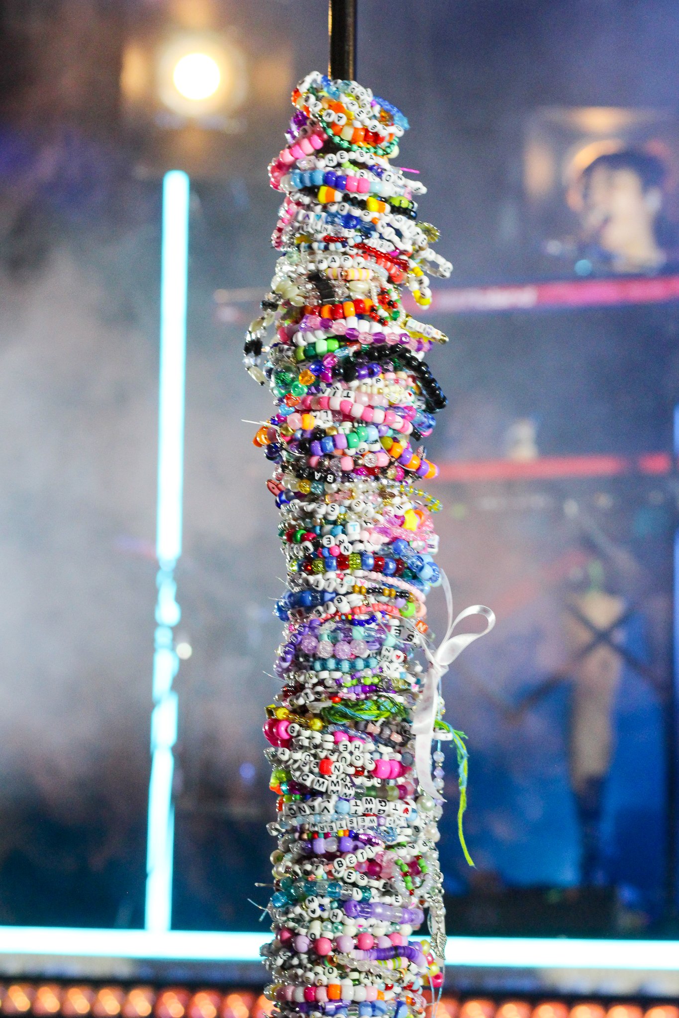  Friendship bracelets decorate Maisie Peters' microphone stand. The singer has collected bracelets from fans since the start of her tour in August. 