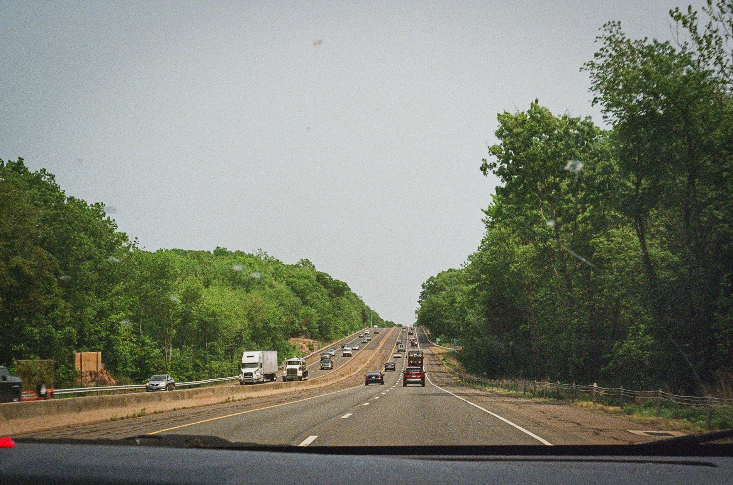    “As you promised me that I was more than all the miles combined''   Kahan references driving frequently in his recent works. This photo captures the unexpected beauty of New England highways and visually represents the opening lines of the album’s