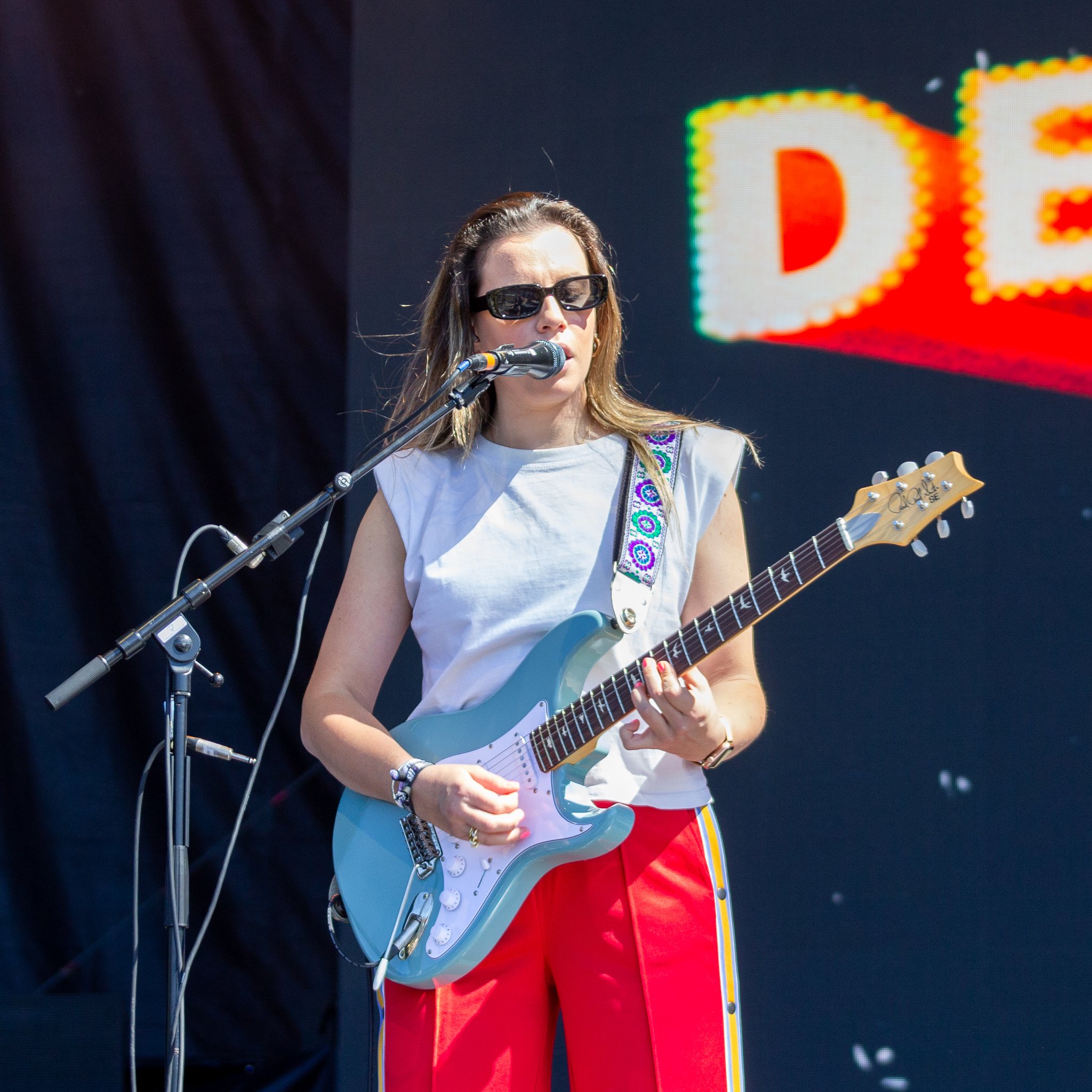  Isabel Torres plays guitar for Declan McKenna’s groovy song “Why Do You Feel So Down.” 