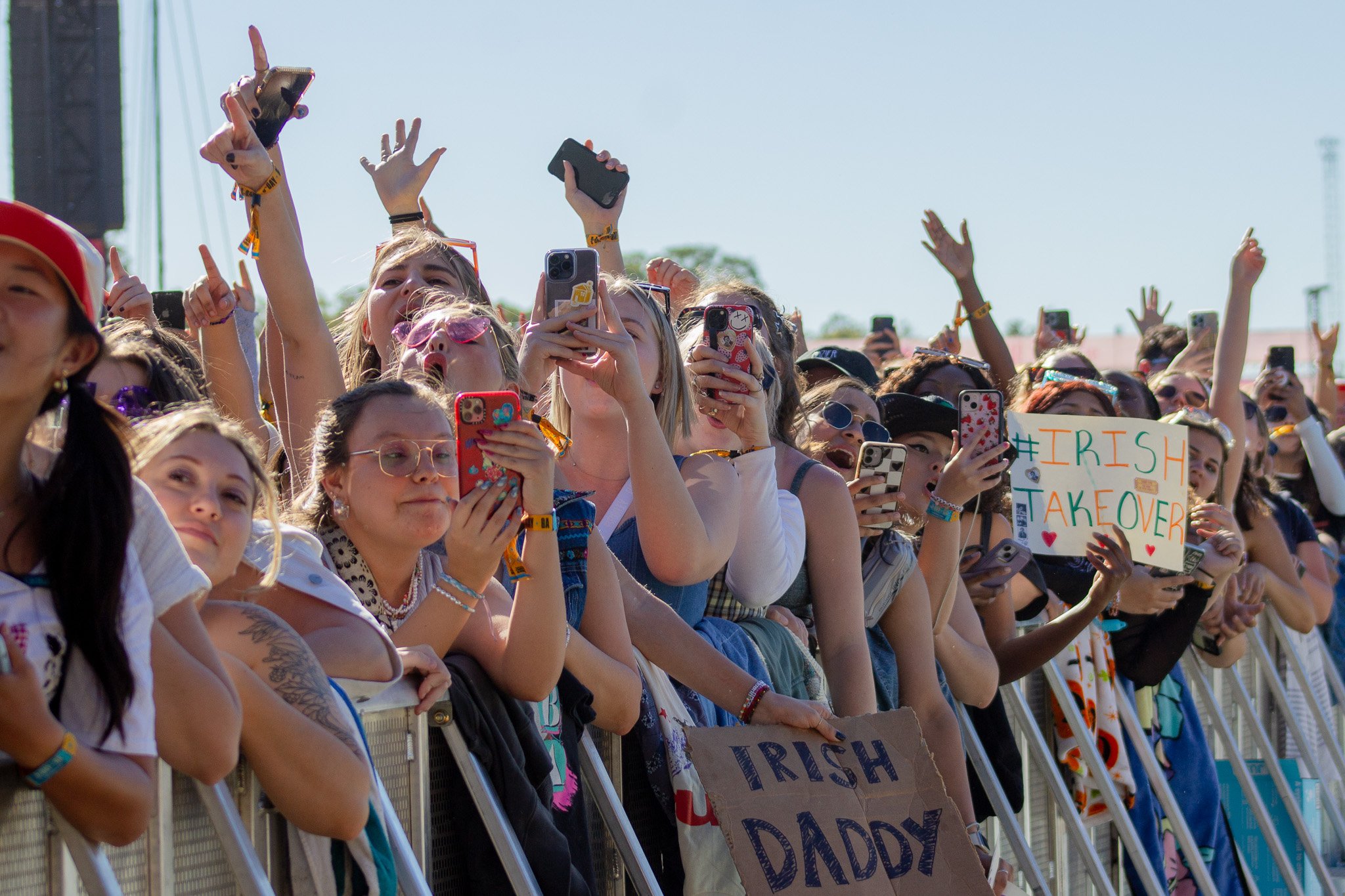   The crowd cheers on Irish singer Niall Horan at the American Express stage. 