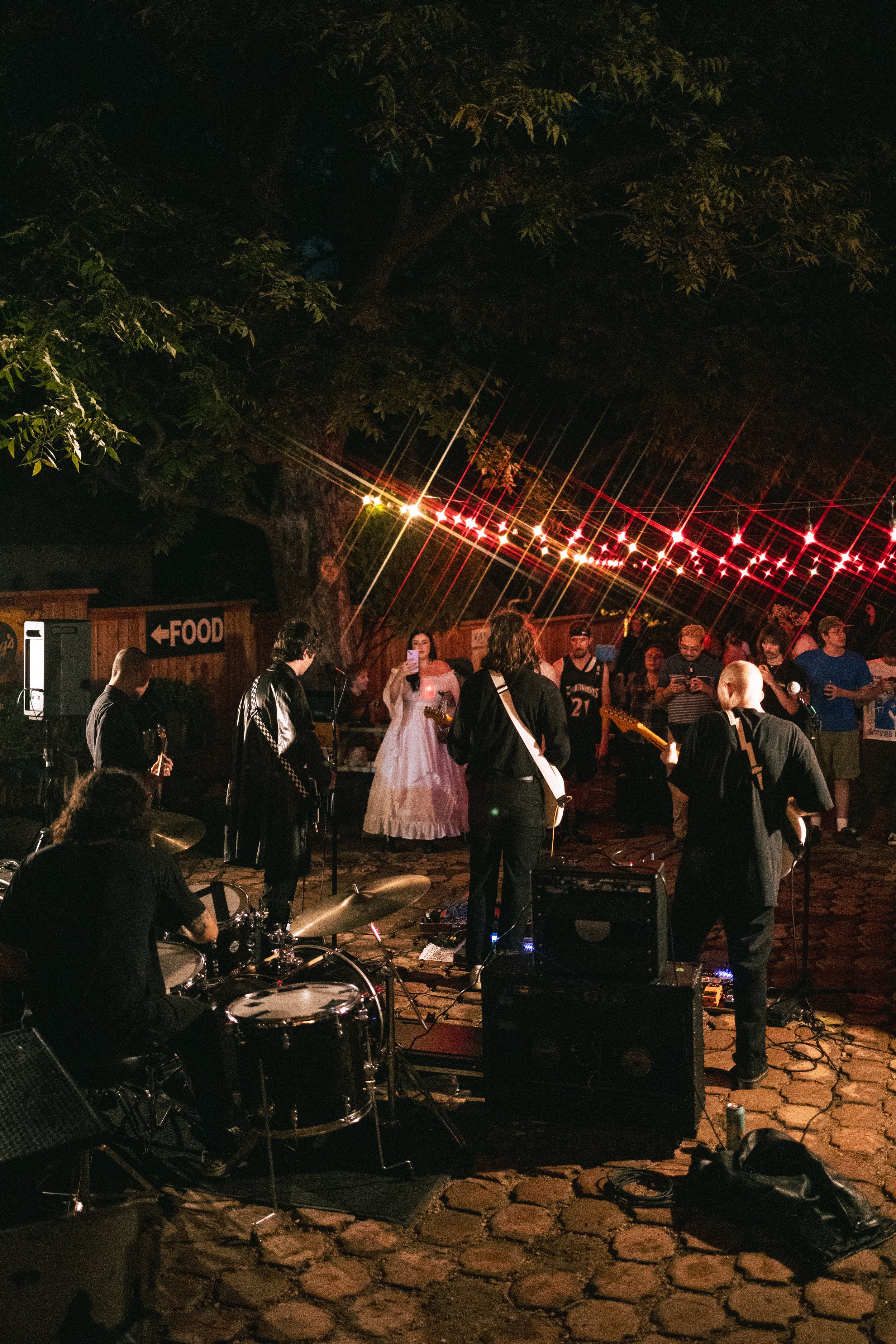   Whisper performs for the Halloween crowd at Tweedy’s. This is the alternative group’s debut concert.  Photo by Amelia Tapia  