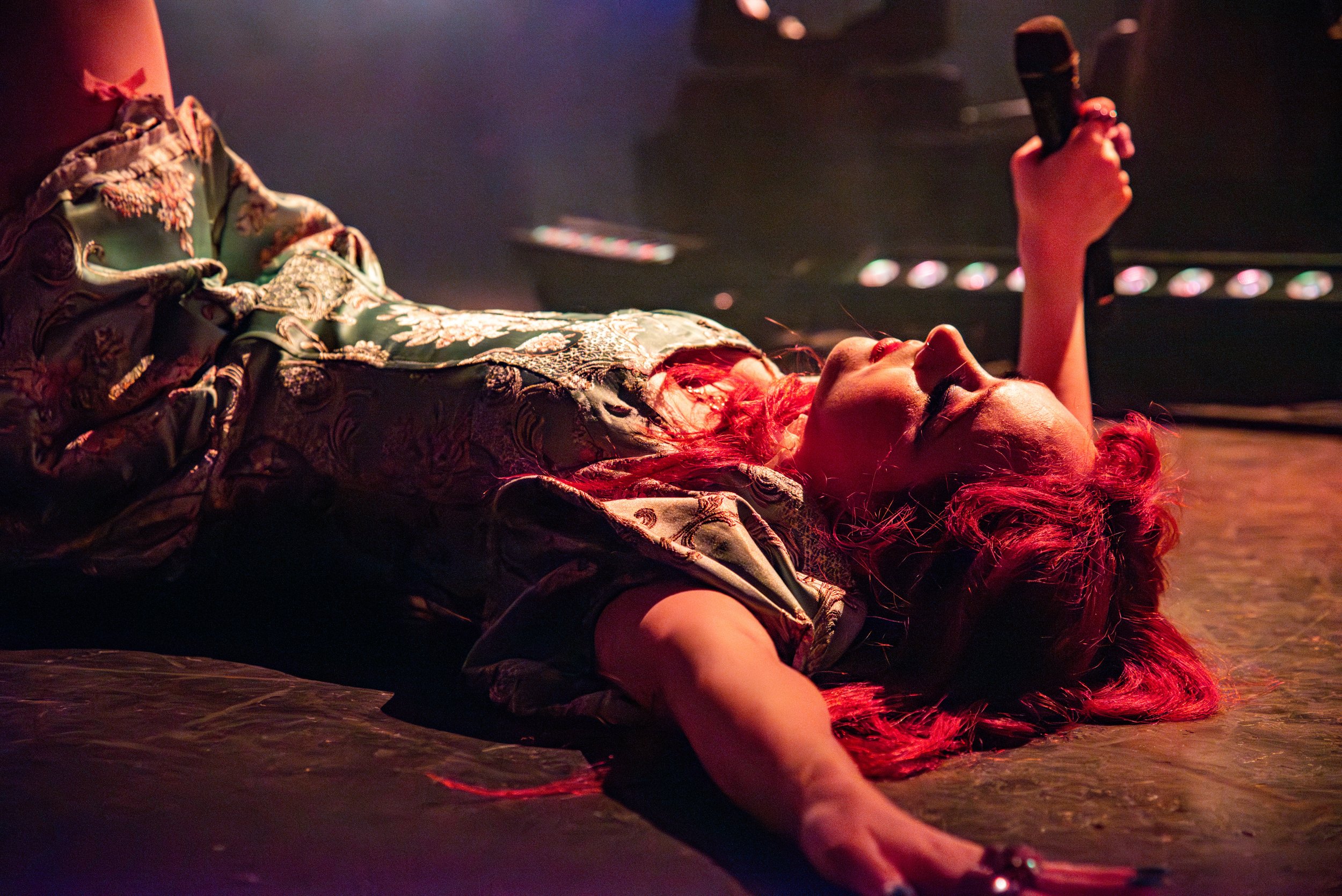  Chappell Roan lies down after performing “Femininomenon” as the melody for “Red Wine Supernova” begins. 