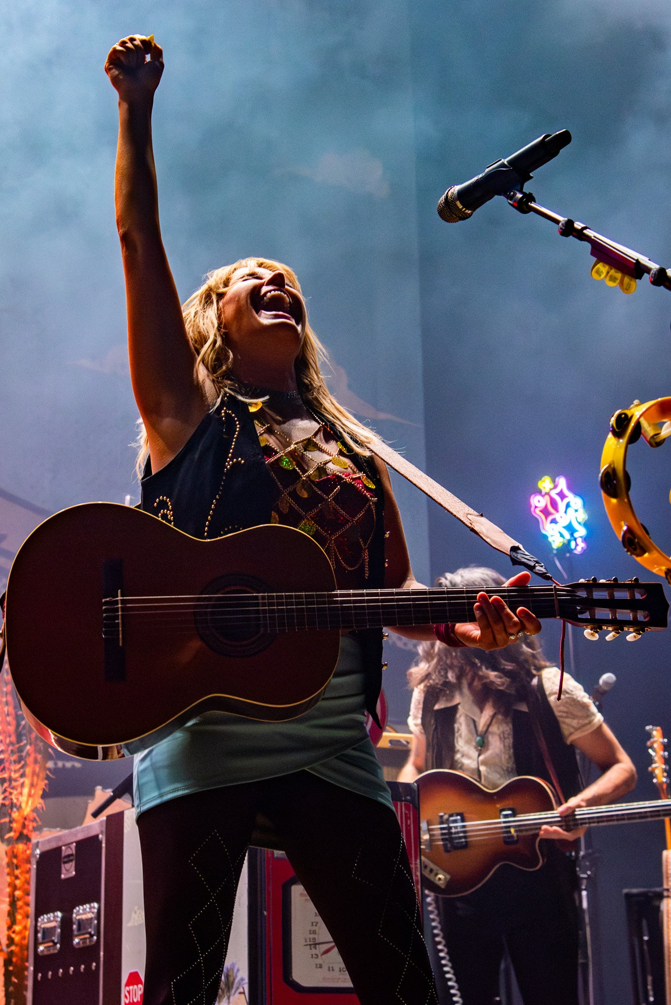  Grace Potter smiles as she belts out a scream, lifting her hand before giving one last strum of her guitar. 