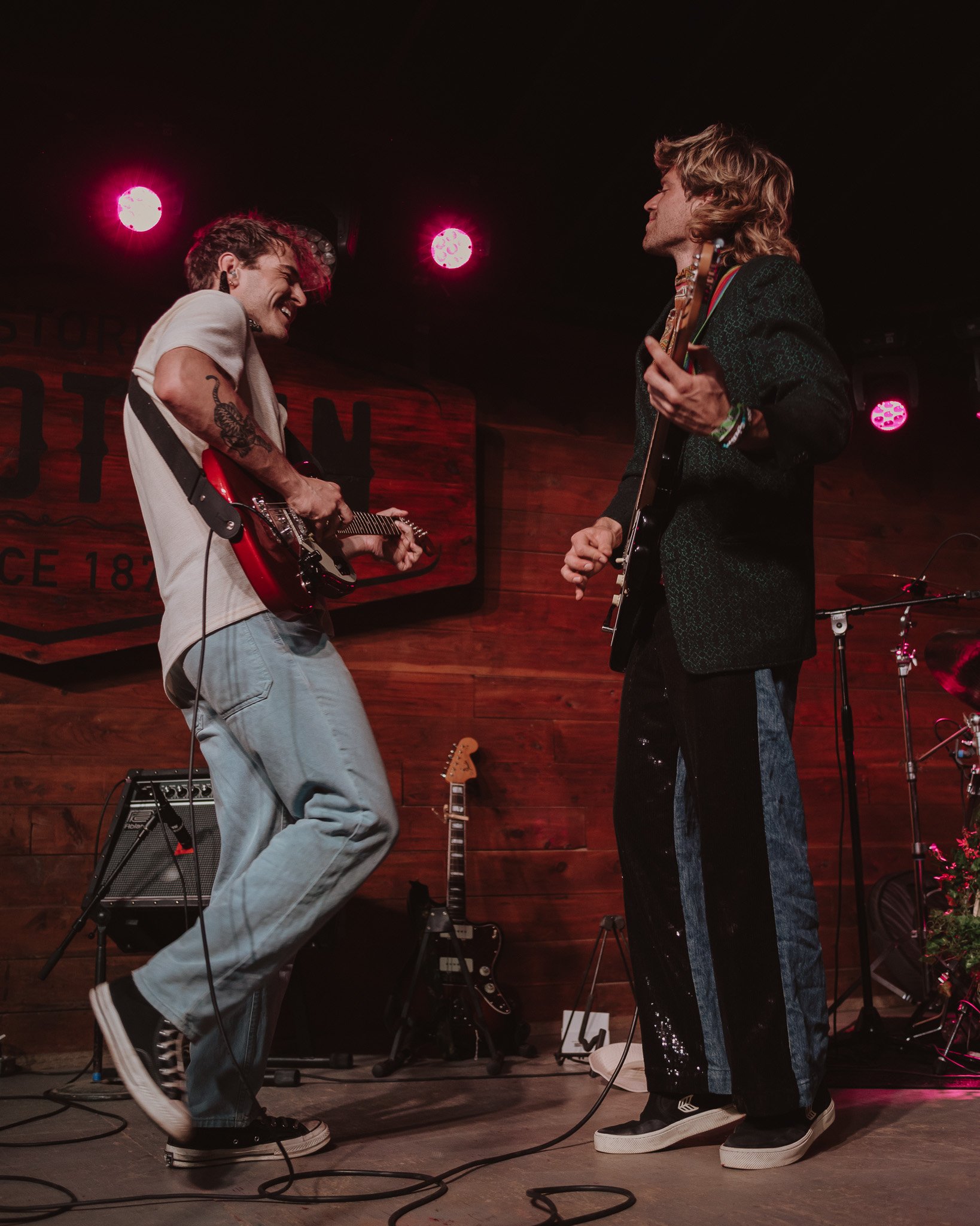  &nbsp;James and Sharp smile as they perform with one another. 