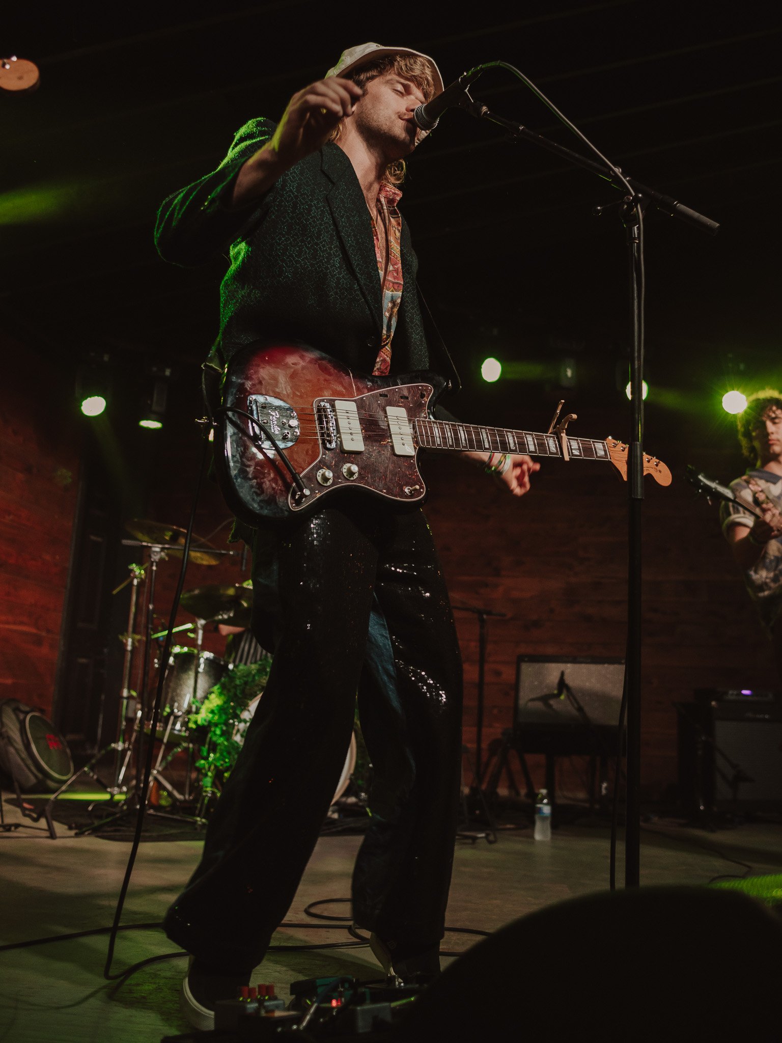  The Moss frontman Tyke James owns Scoot Inn’s historic stage in a sparkly black suit. 