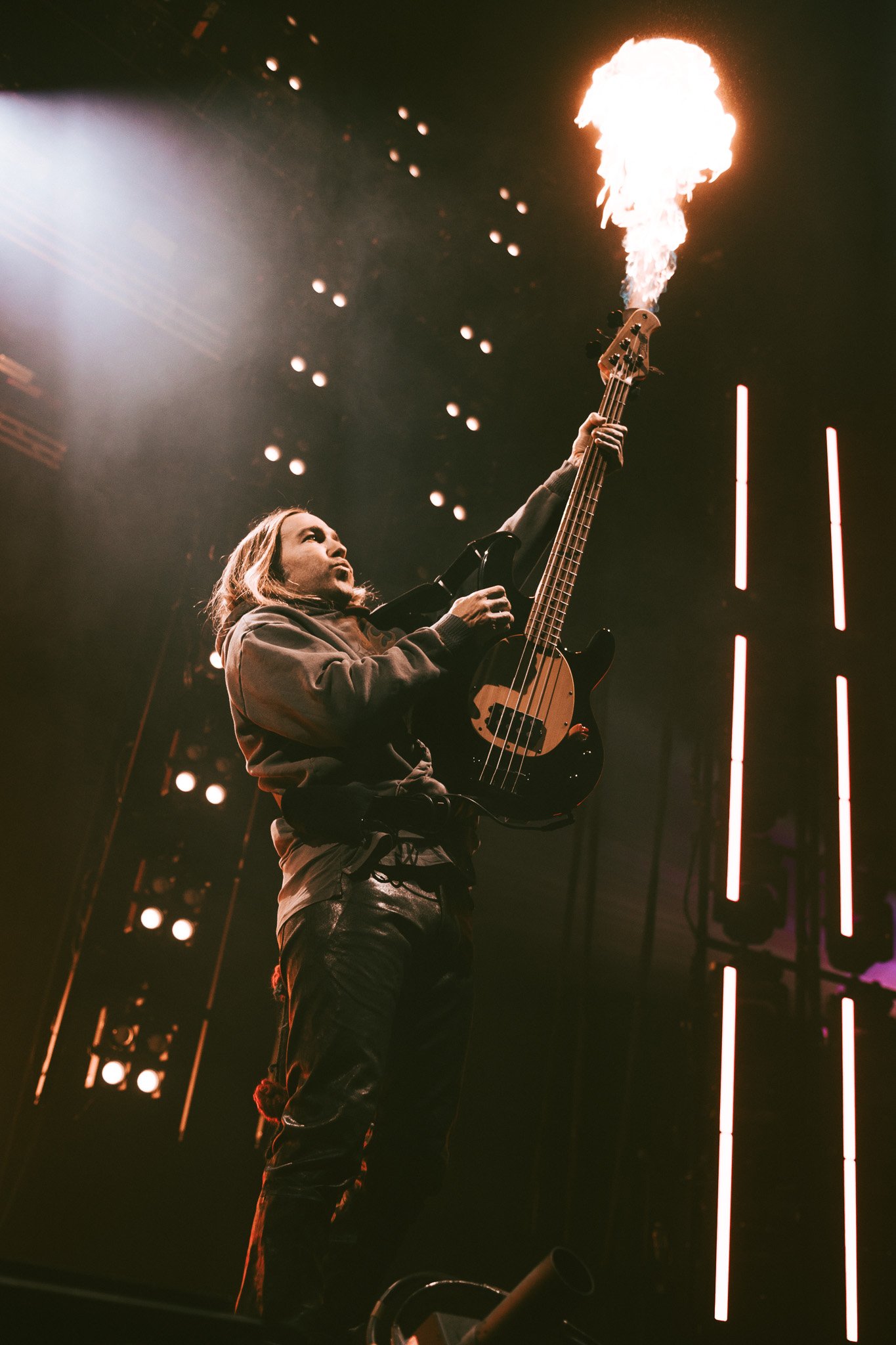  Fall Out Boy bassist Pete Wentz performs with a fiery bass. 