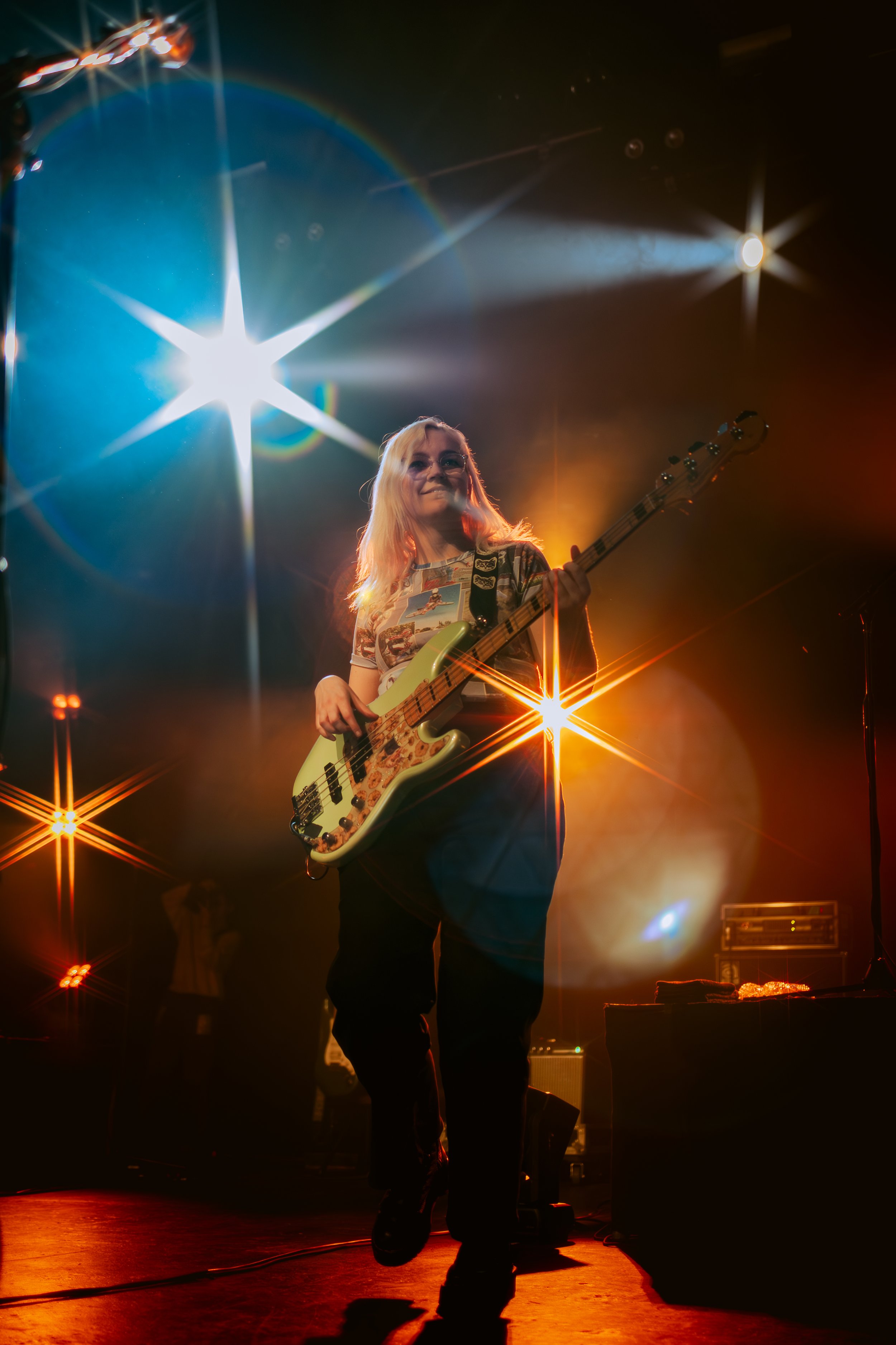  Madeline Jarman, the bassist of flipturn, smiles at the energetic crowd. 