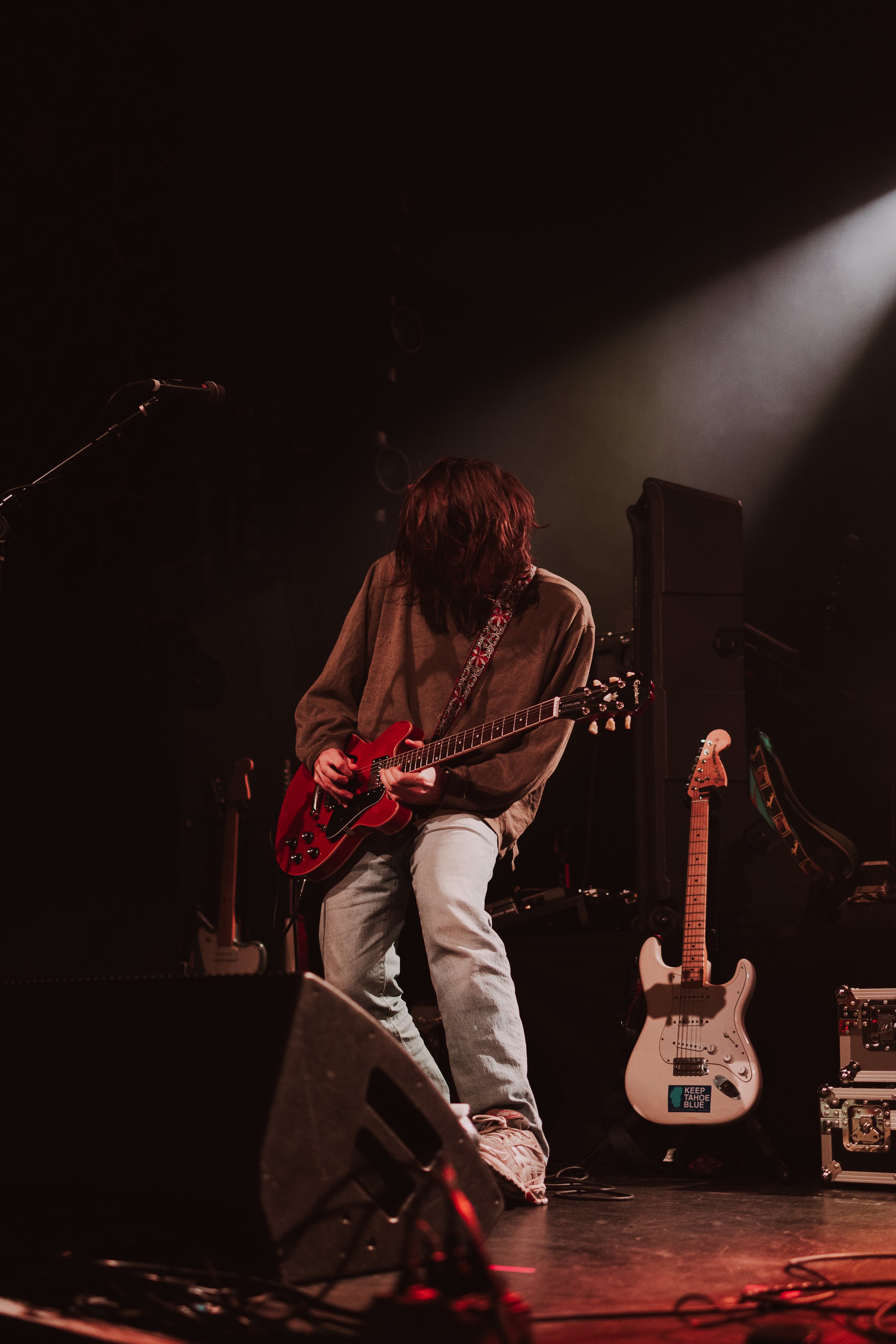  Richy Mitch &amp; The Coal Miners’ guitarist flips his hair back and forth during a guitar solo. 