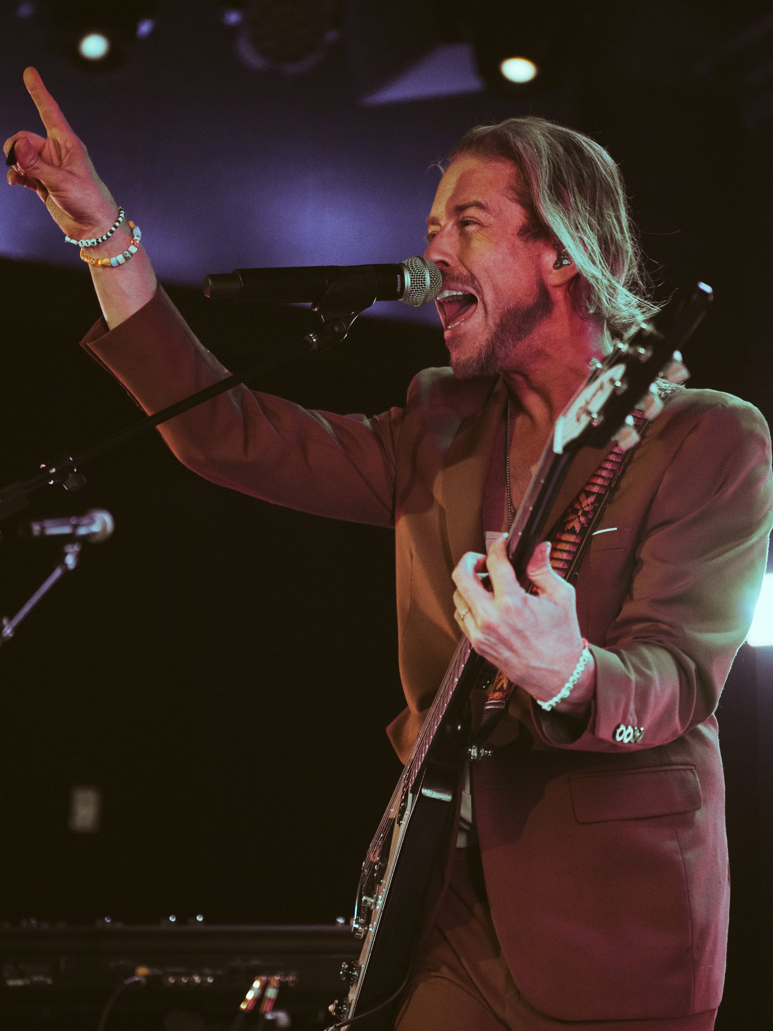  Avary points to the crowd as he sings. 