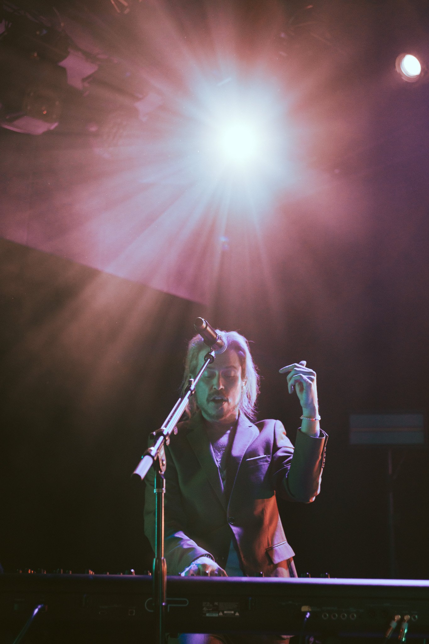  Avary plays his keys under the bright lights. 