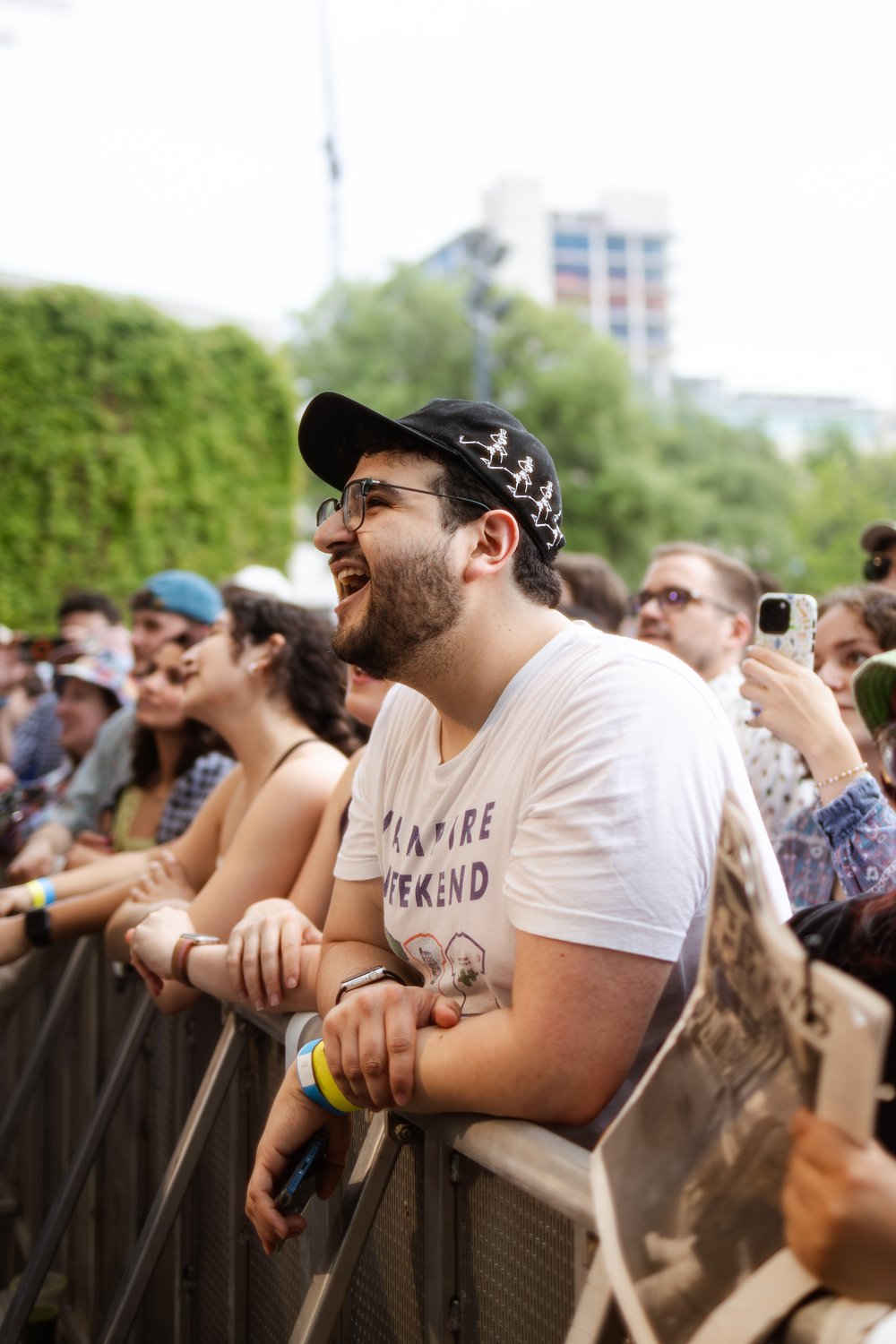  A fan smiles adoringly at the stage where indie-alternative band Vampire Weekend performs.&nbsp; 