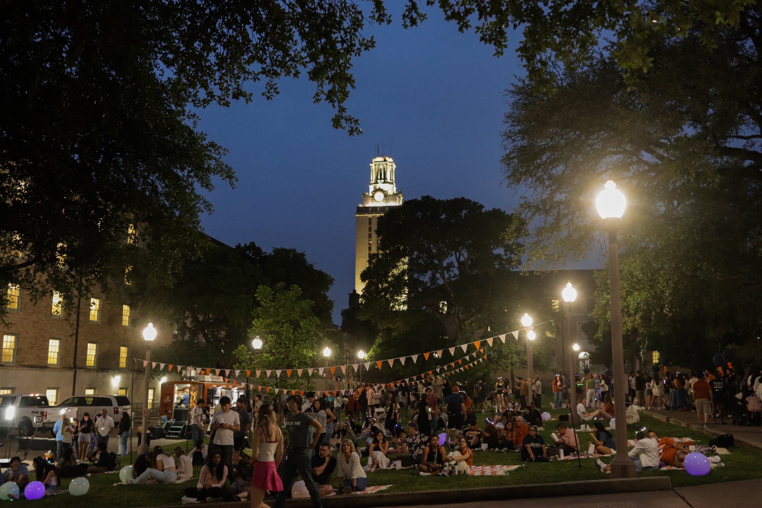  Concert-goers relax on the honors quad lawn and enjoy the Longhornchella festivities. 