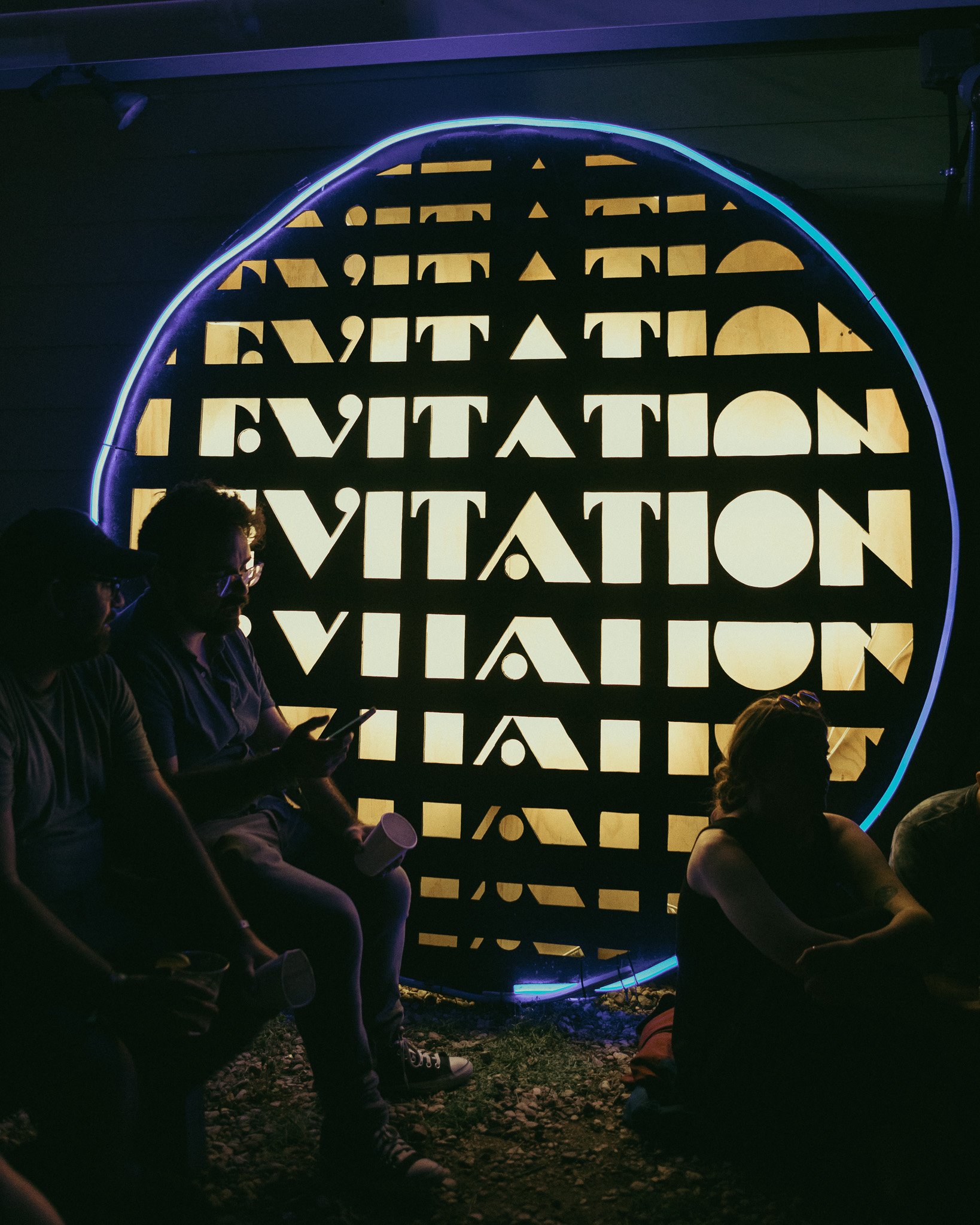  &nbsp;A lit-up Levitation sign rests against the Far Out Lounge wall. 