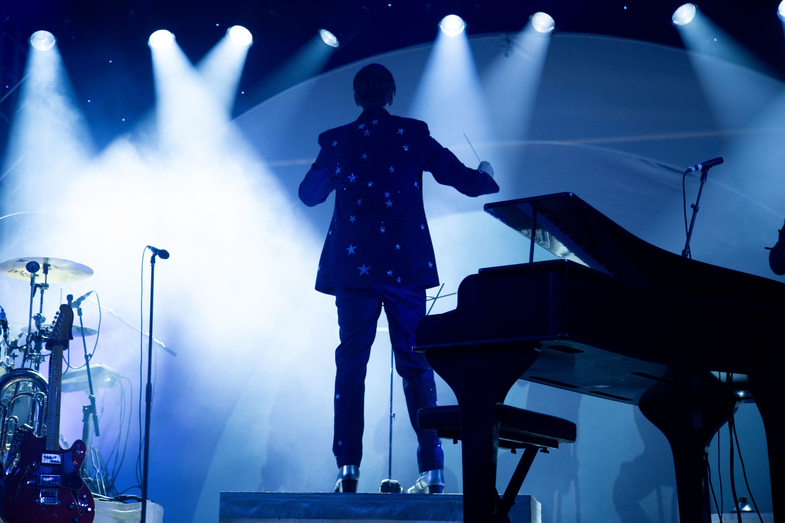  Lights flash on as lead singer and pianist AJ Jackson sings the 2012 hit “Puzzle Pieces” to the large crowd at Stubb’s Waller Creek Amphitheater. 