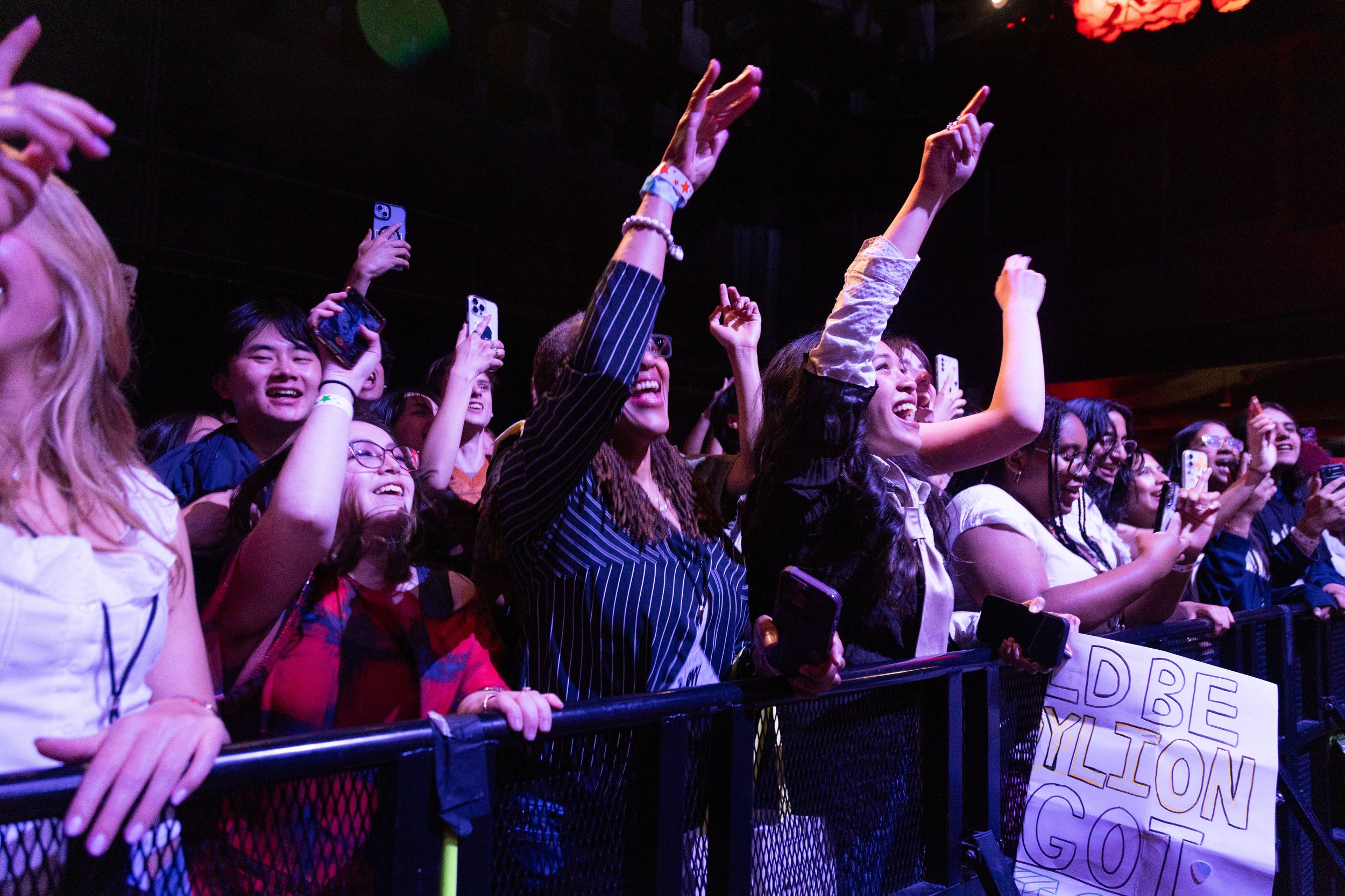 Fans cheer and throw their hands up as opener Rocco performs his song, “Only Boy.”