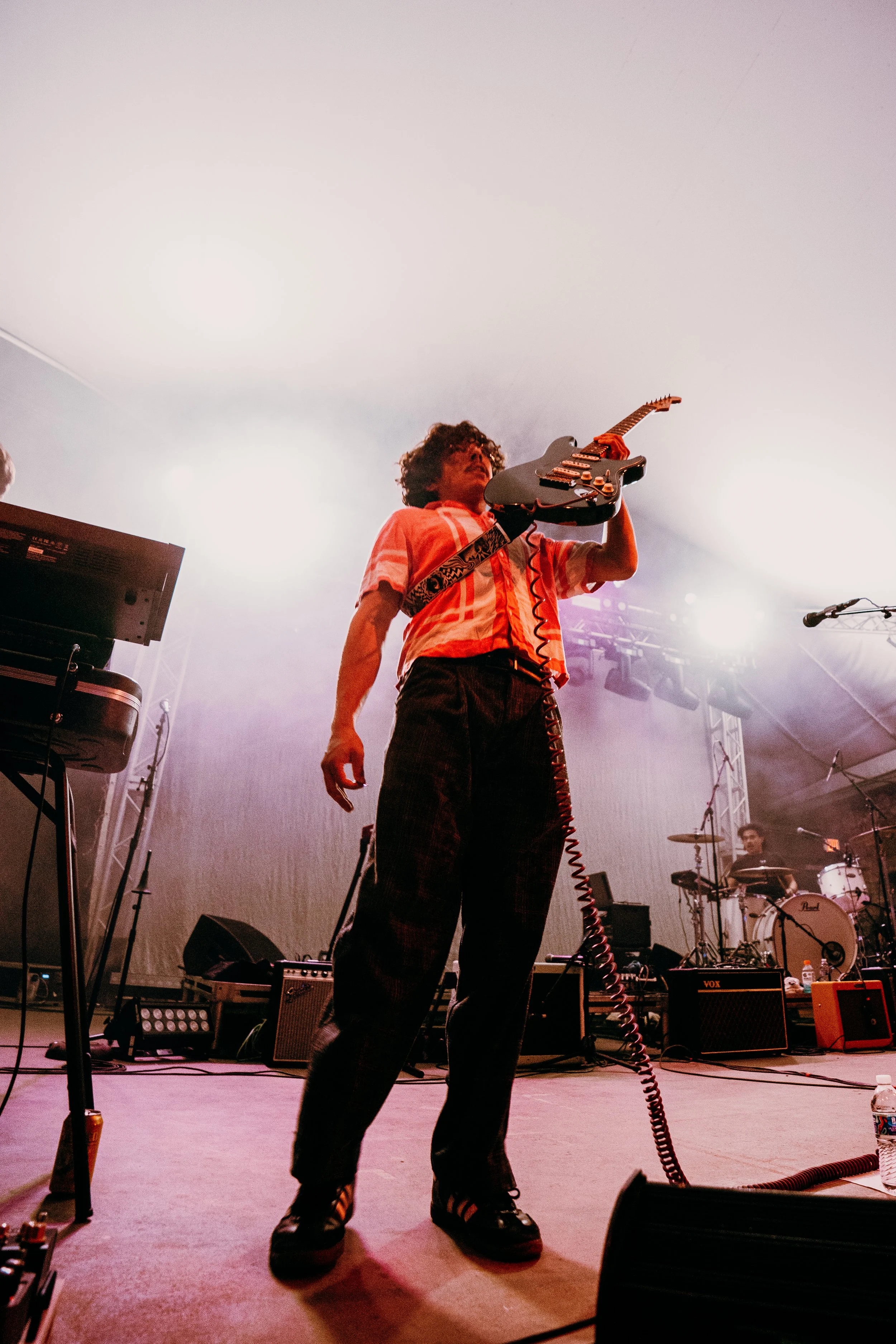 Lead singer and guitarist Conner Redden holds his guitar out to the audience after a solo during Flight By Nothing’s opening song “Welcome to the Void.”