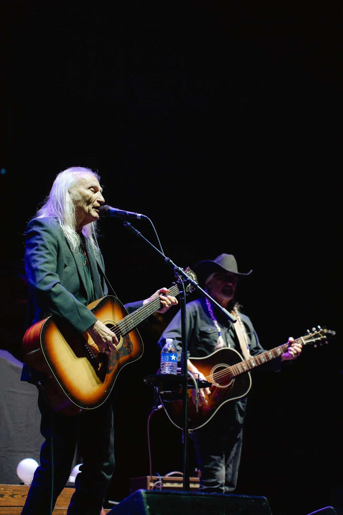 Dave Alvin and Jimmy Dale Gilmore start off the night with a twangy, grounding performance of their song, “We’re Still Here.”