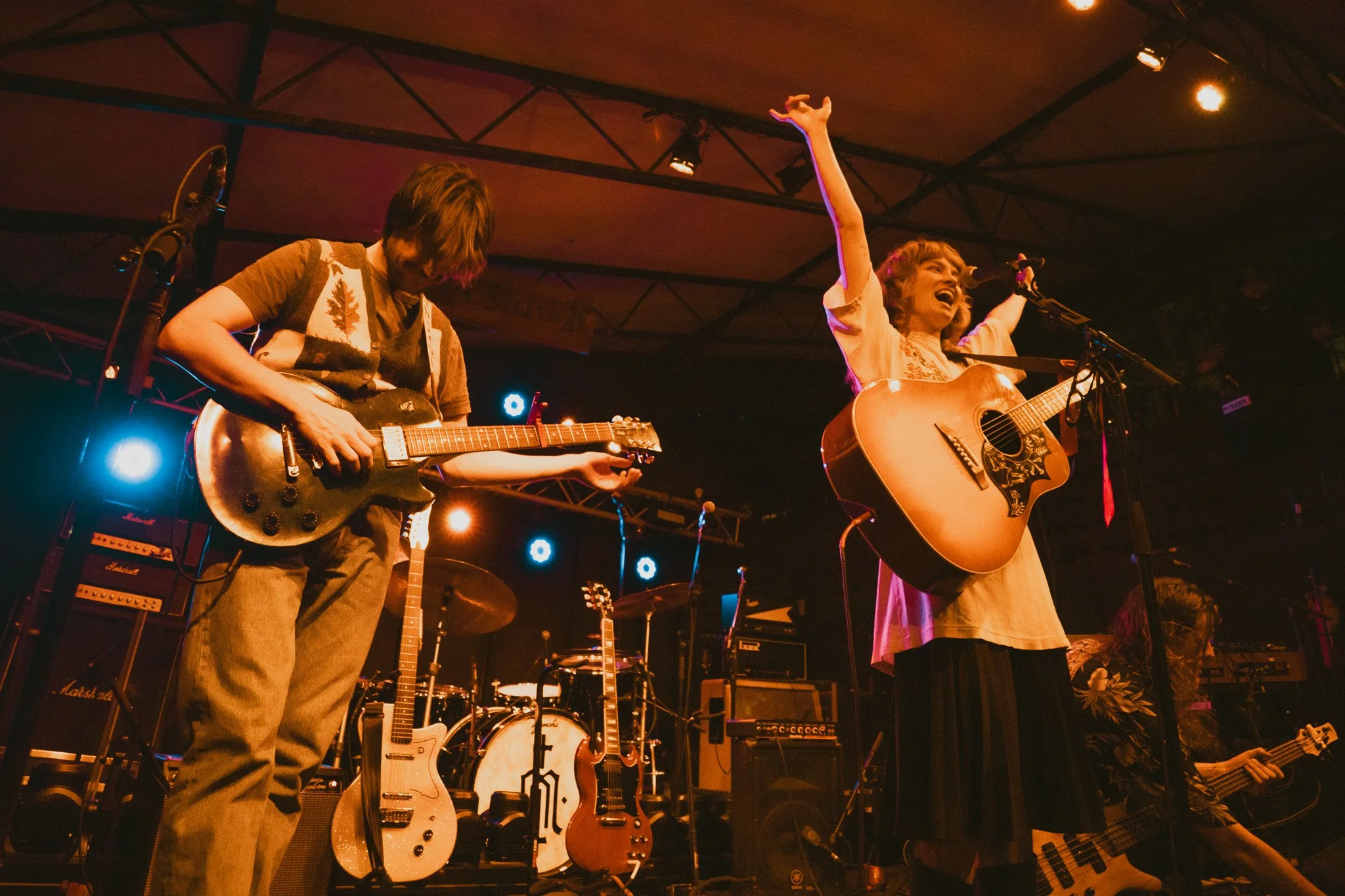 Opener Linka Moja raises her arms in excitement for the set which included original songs and covers, such as “Going to California” by Led Zeppelin.