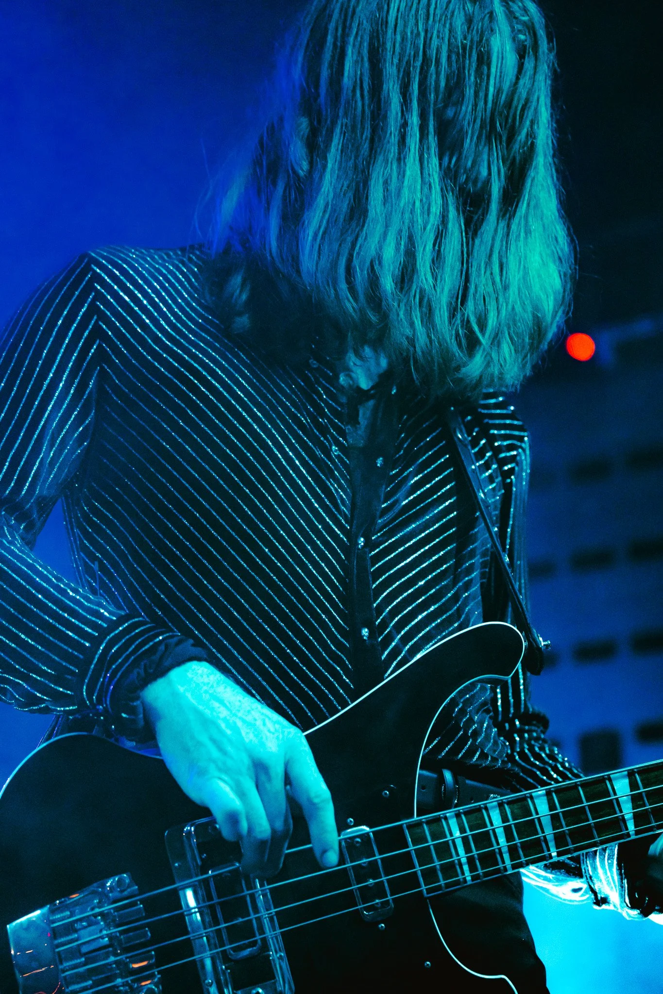 A sea of blue light engulfs Kiszka and bassist Nick Pini as they take the audience on a journey during their performance of “Feels Like Gold.”