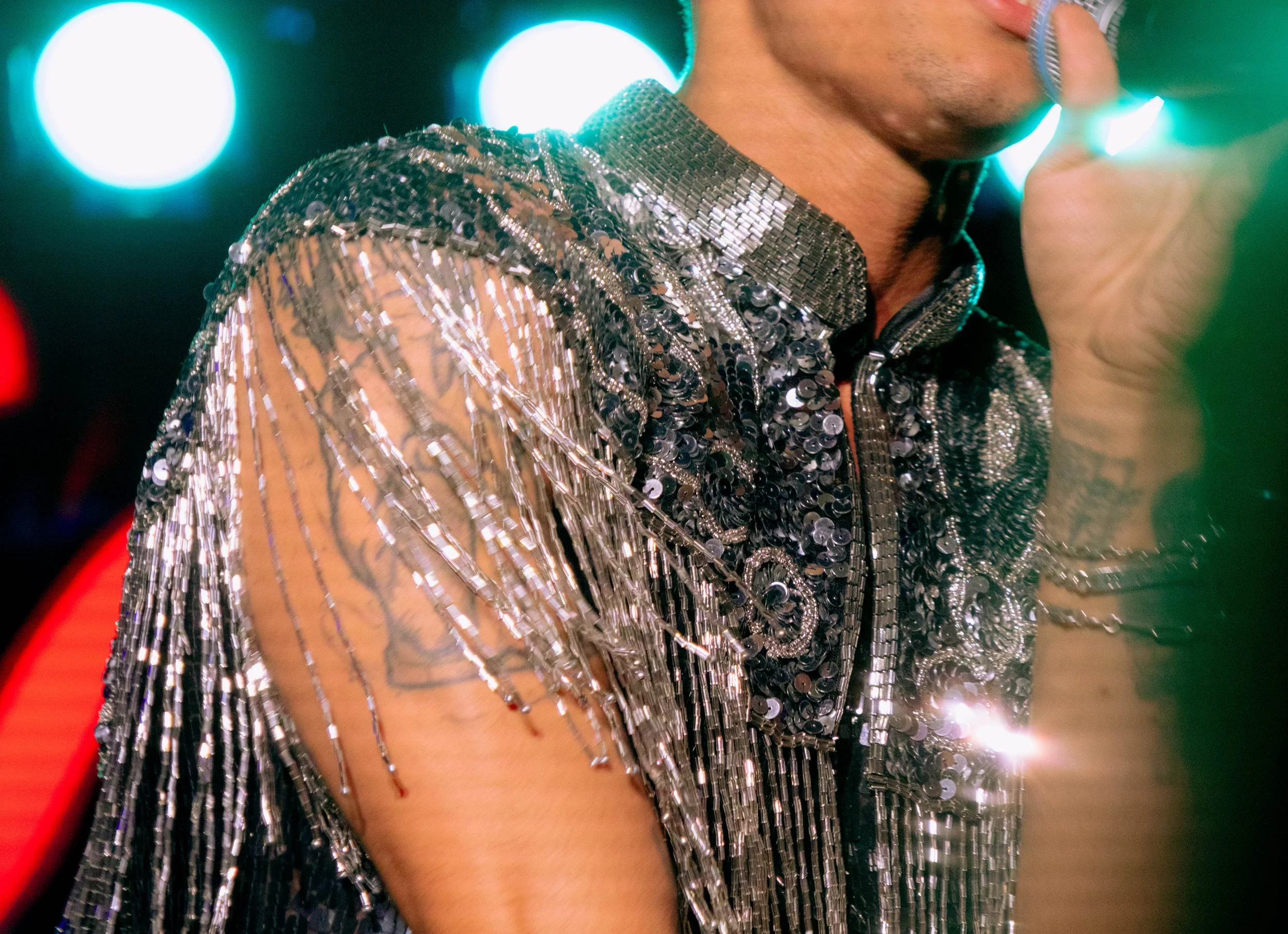  Honoret wears a sparkly fringe outfit during his performance of single “Never Sold.” 