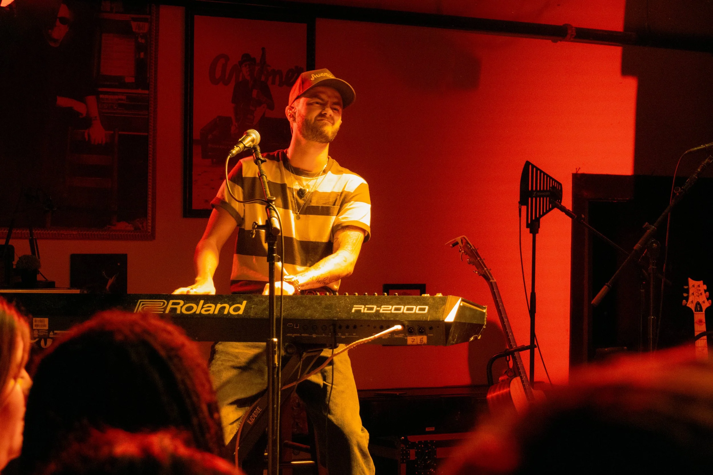  Jack Johnson plays the piano during “Fire” in red lighting, matching the heat of the song. 