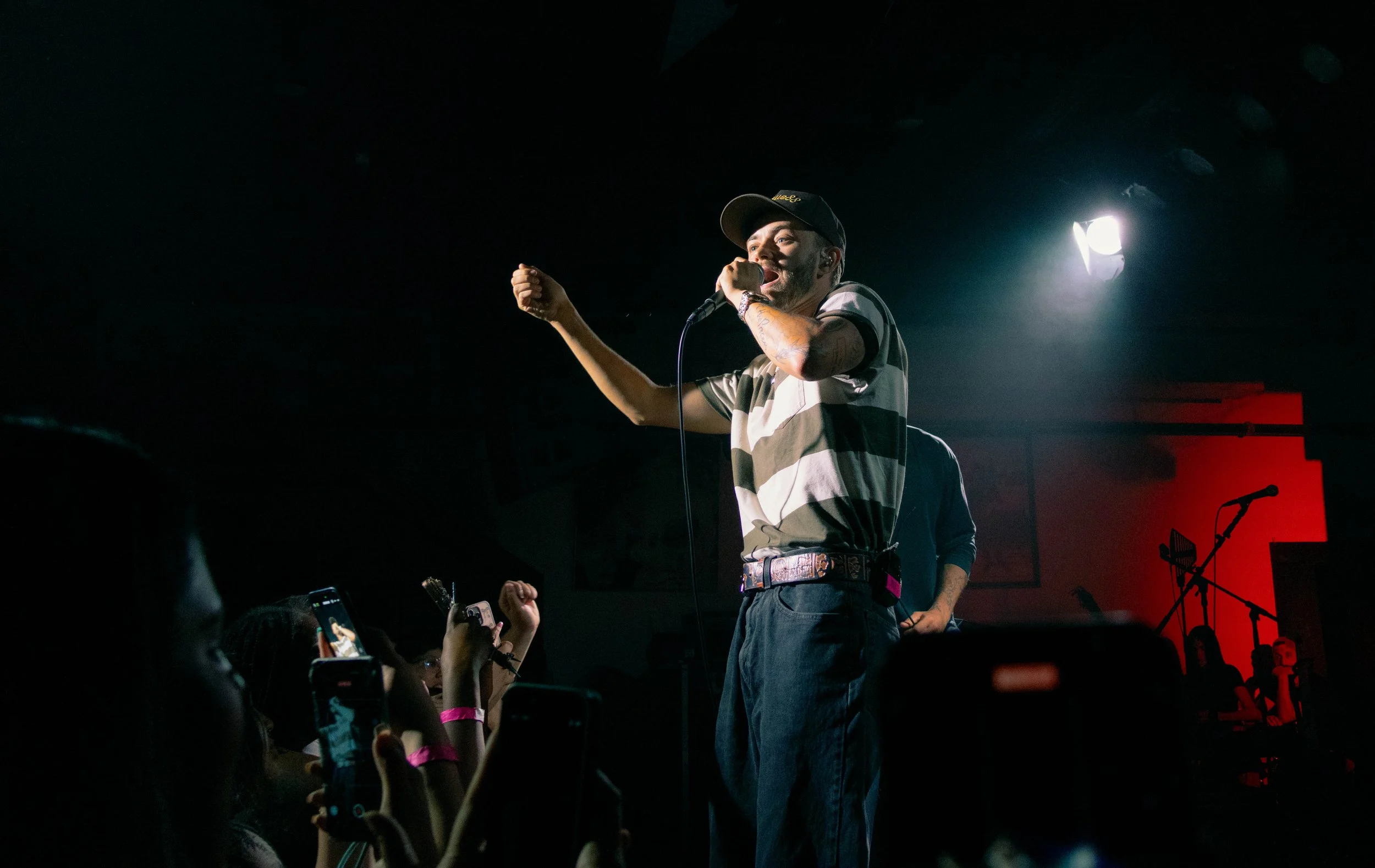  Johnson performs the lyrics, “I’m about to tie up a lasso and grab her the moon,” from the song “Bonnie &amp; I” and hypes up the crowd. 