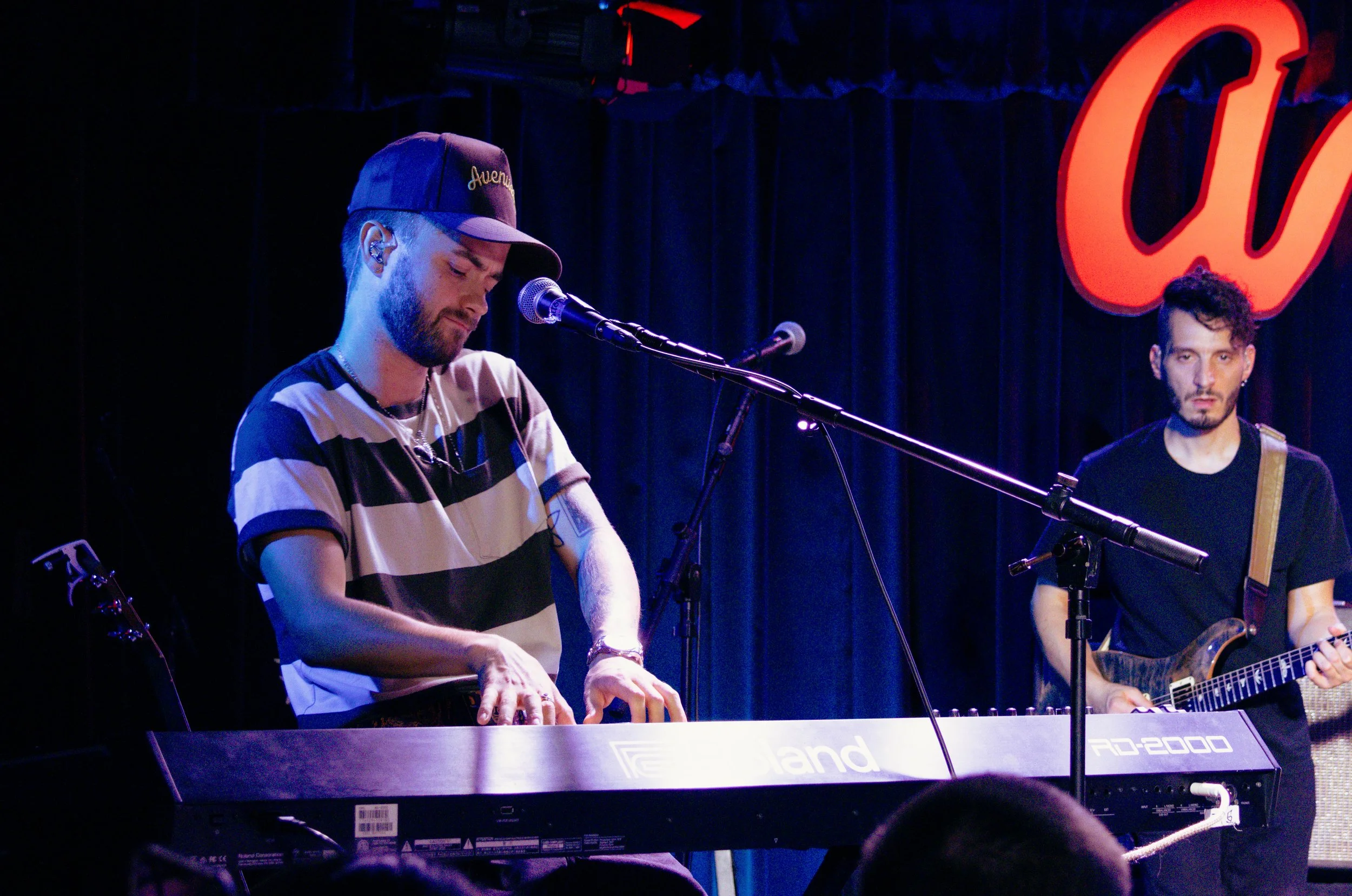  Johnson plays the keyboard effortlessly during the song “baby blue.”    