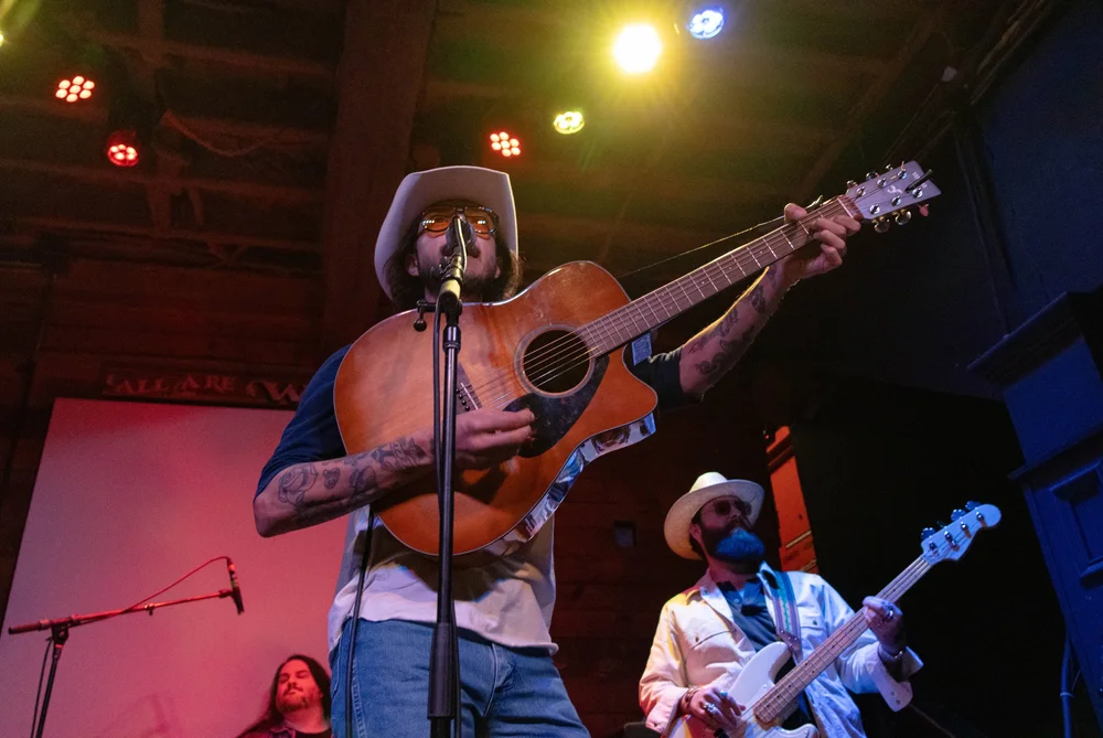 Cory Cross plays guitar while singing his opening song “Road Dog Prayer.” 
