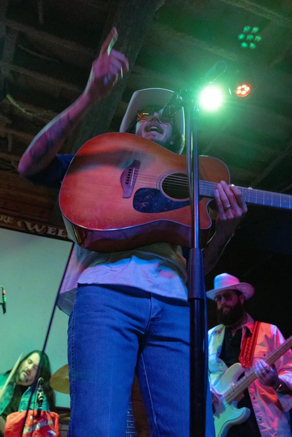  Cross points to the audience while singing the lyrics to song “Cold Beer Hot Summer Night.” 