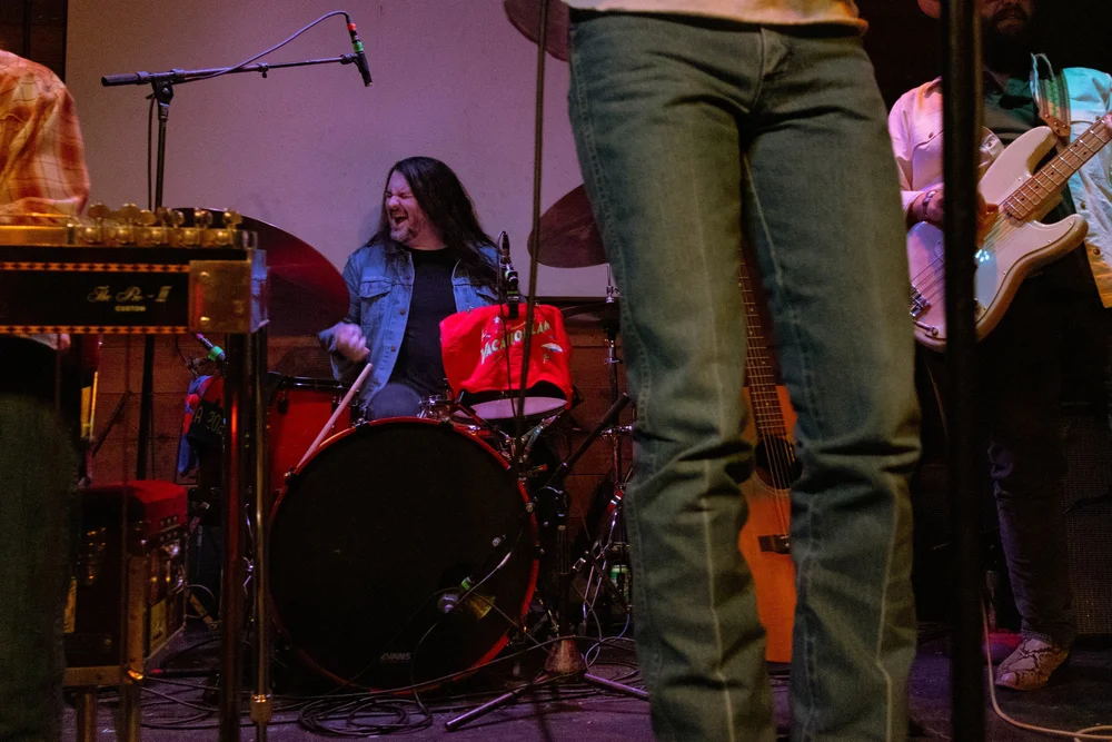  Taylor Jordan rocks out to the lively country song “Cold Beer Hot Summer Night” on the drums. 