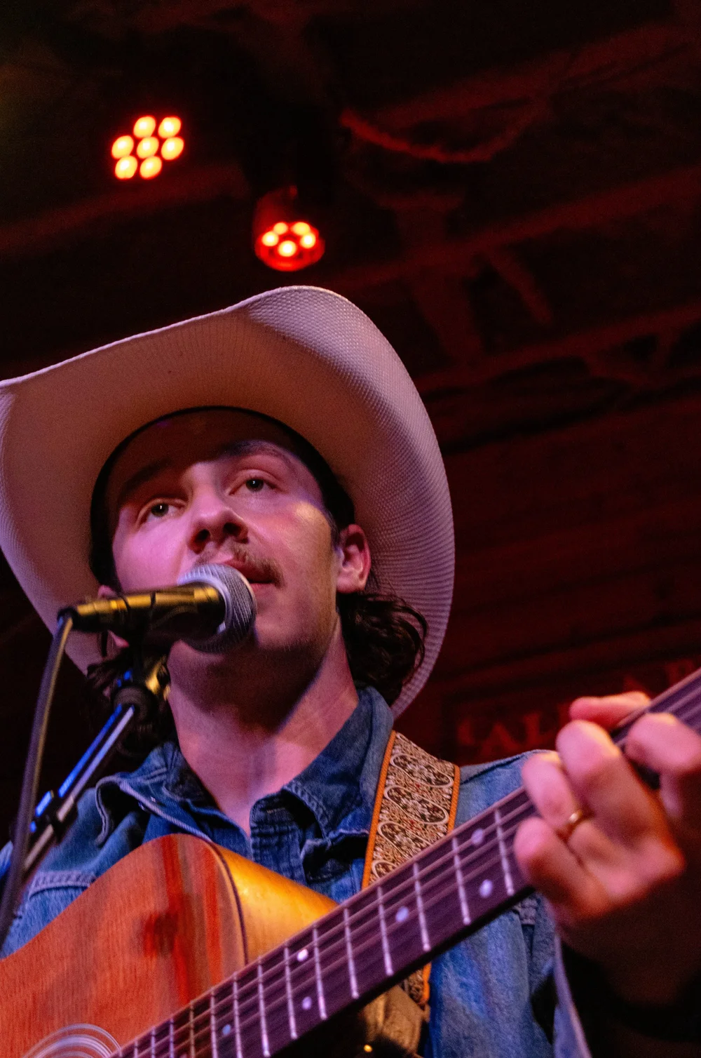  Blocker looks out at the crowd during his cover of “Big River” by Johnny Cash. 